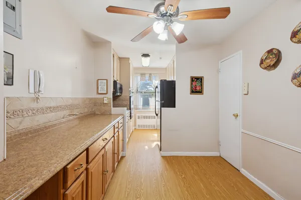 a view of a kitchen cabinets a sink and dishwasher