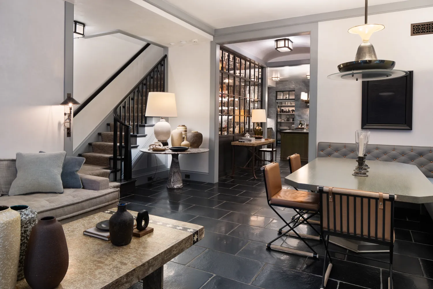 a kitchen with a table chairs and stove