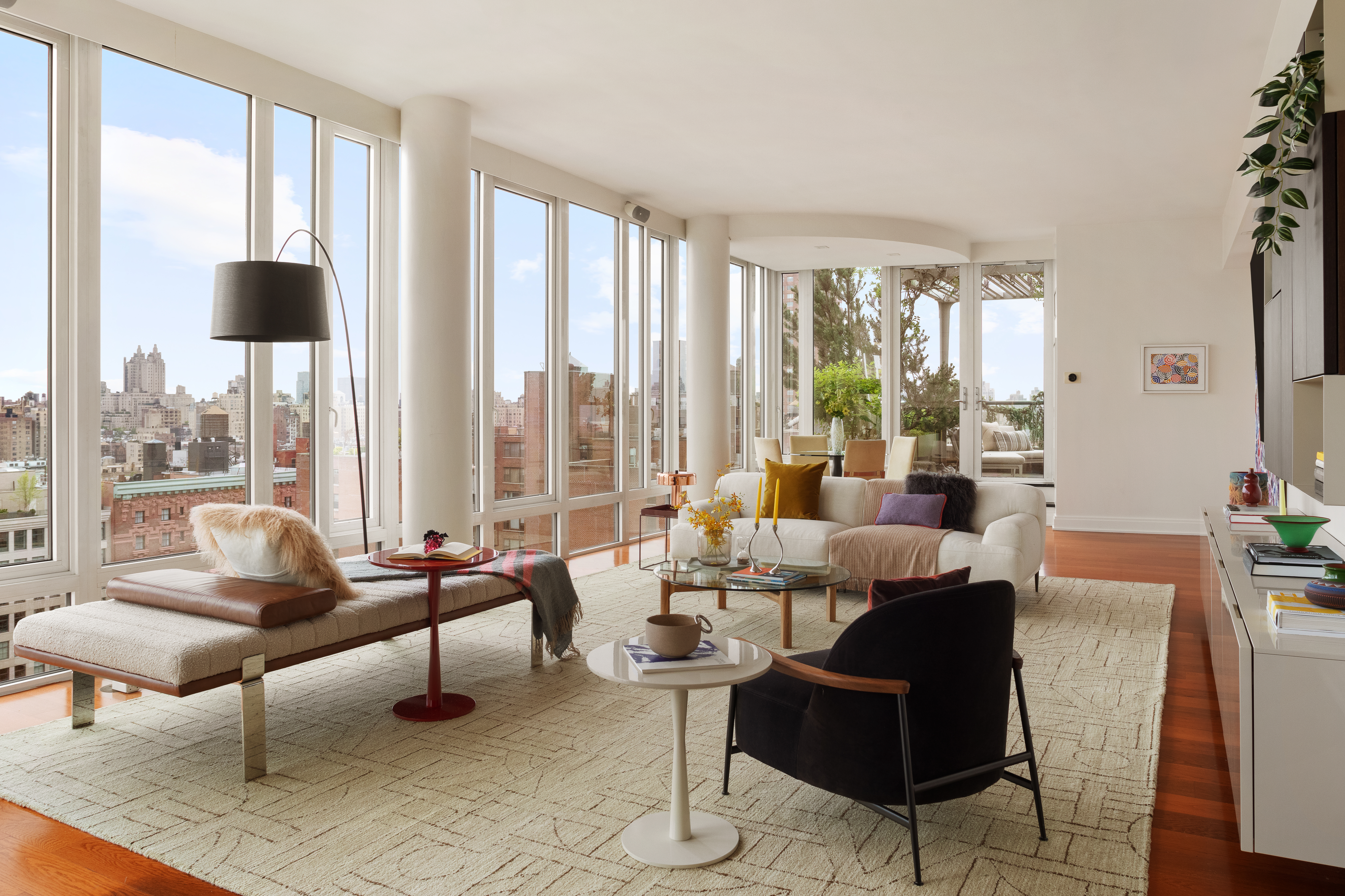 230 West 78th Street, Unit PH19 Manhattan, NY 10024 - Photo 3 of 17 a living room with furniture and a large window