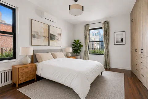 a bedroom with a large bed and a window