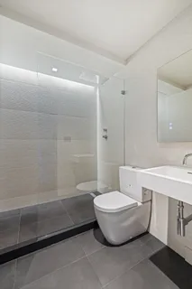 a bathroom with a toilet a sink and bathtub