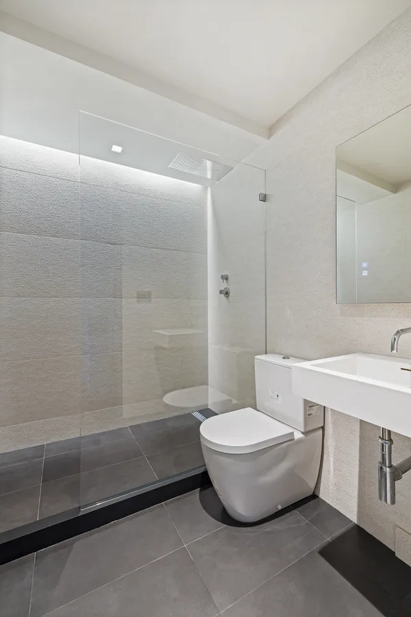 a bathroom with a toilet a sink and bathtub