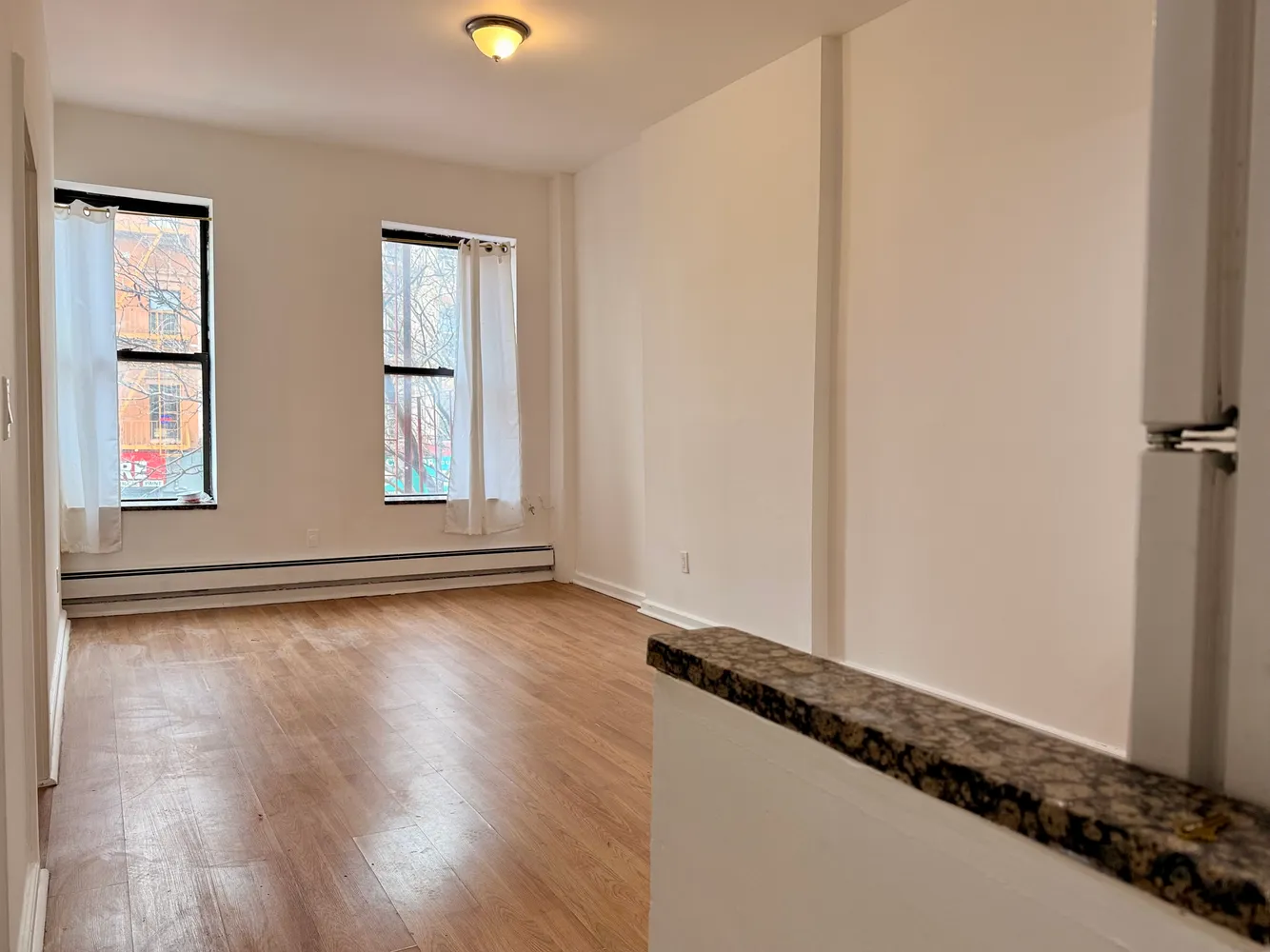 a view of an empty room and window