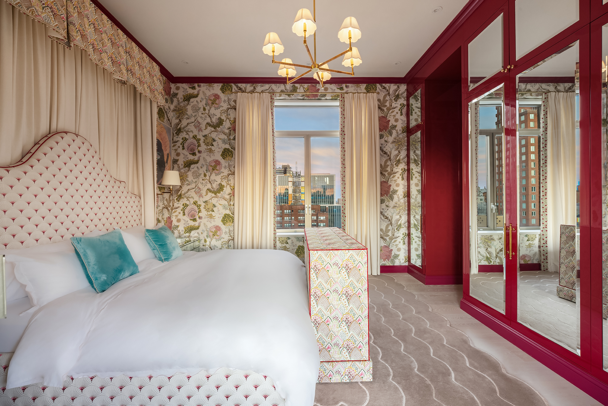 145 East 76th Street, Unit PH Manhattan, NY 10021 - Photo 15 of 25 a bed room with a bed and a chandelier