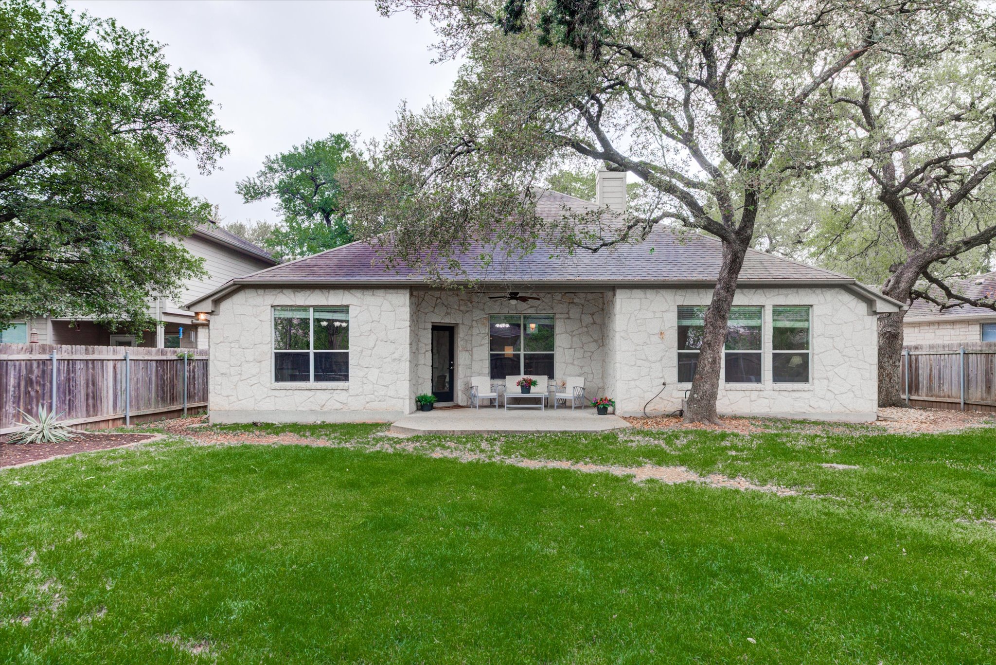 5412 Batak Lane Austin, TX 78749 - Photo 34 of 40 a front view of house with a garden and patio