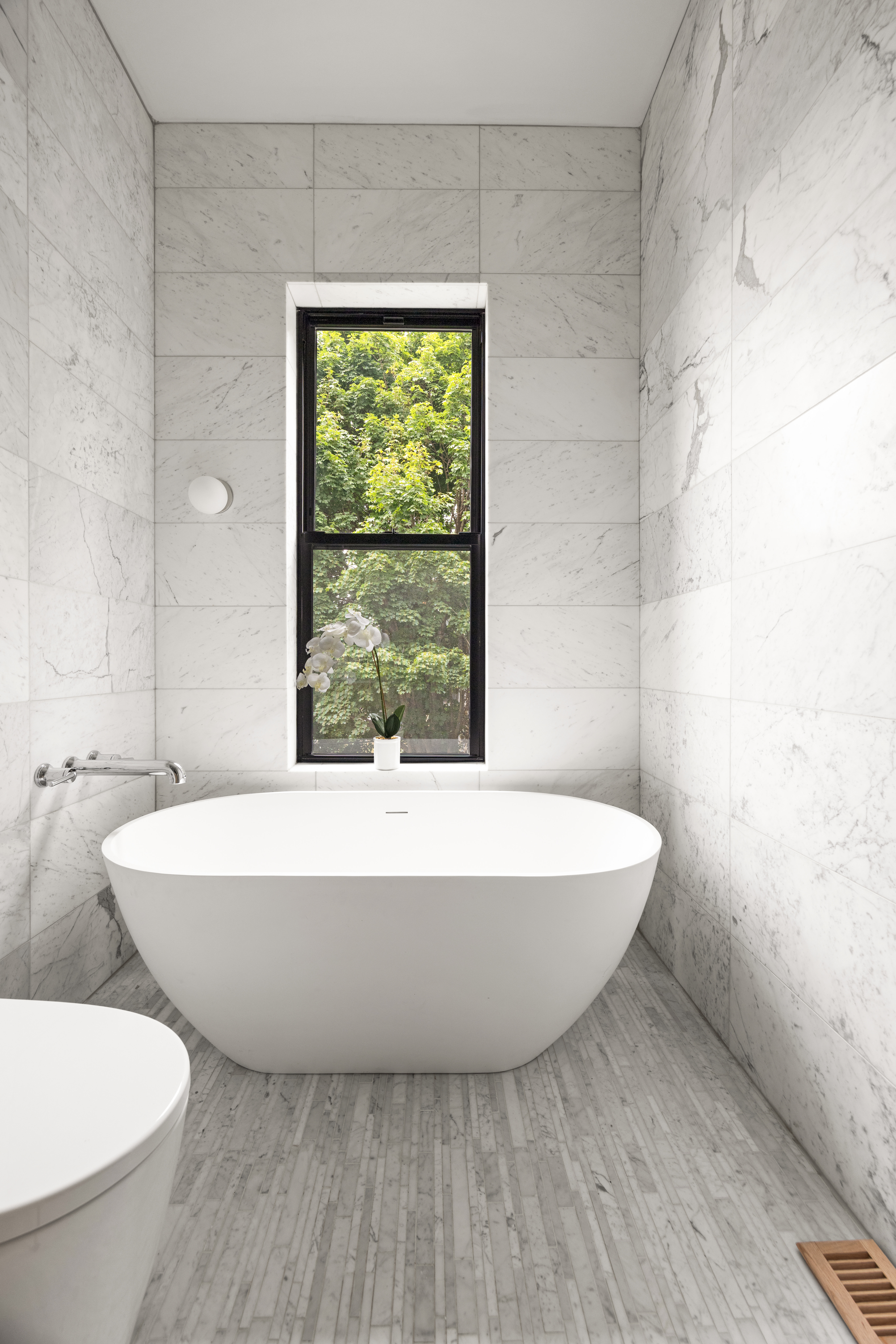 737 Decatur Street Brooklyn, NY 11233 - Photo 13 of 19 a bathroom with a bathtub and window