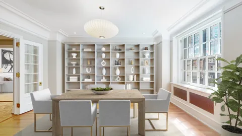 a dining room with a table and chairs
