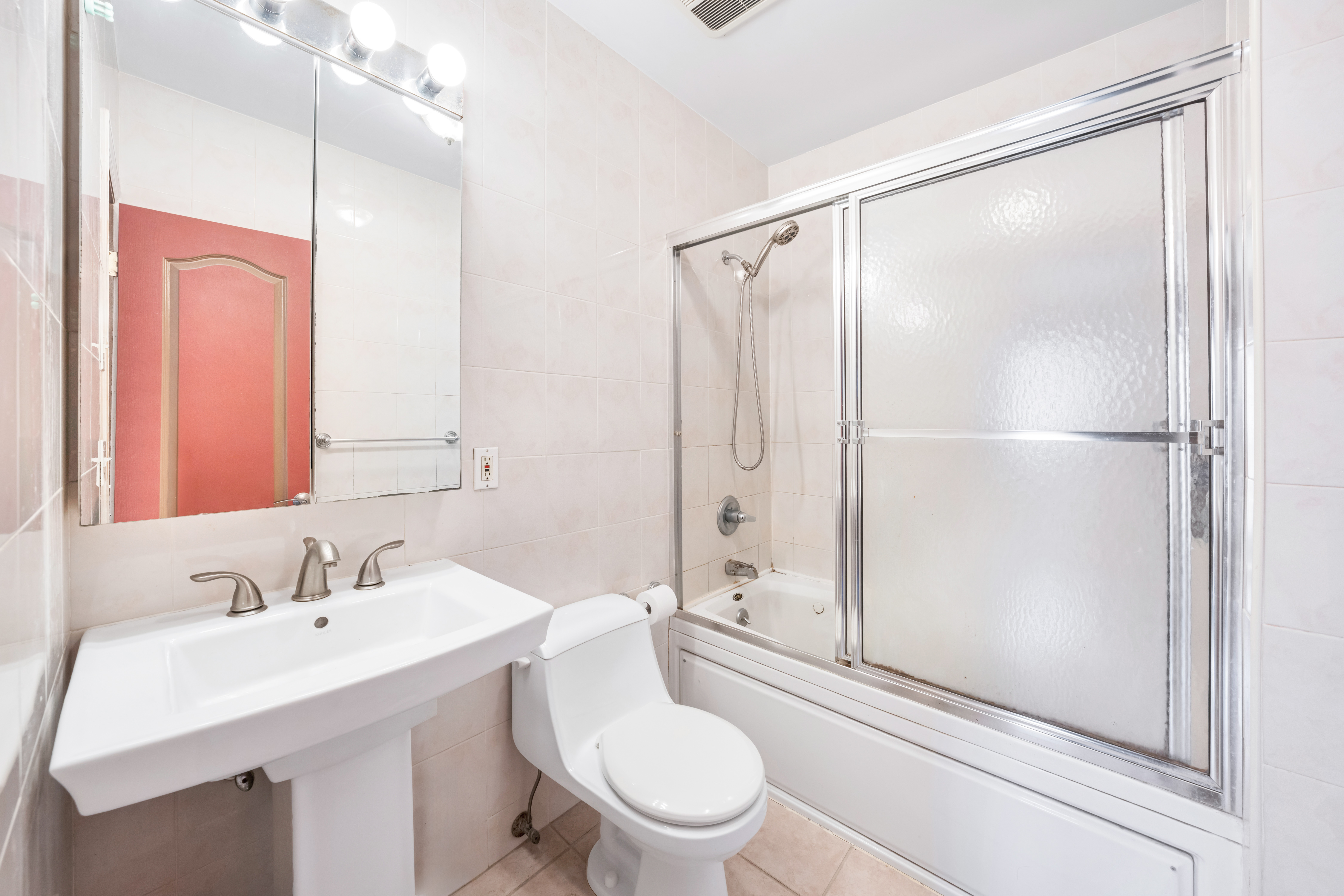 2356 61st Street, Unit 1B Brooklyn, NY 11204 - Photo 5 of 10 a bathroom with a sink toilet and shower