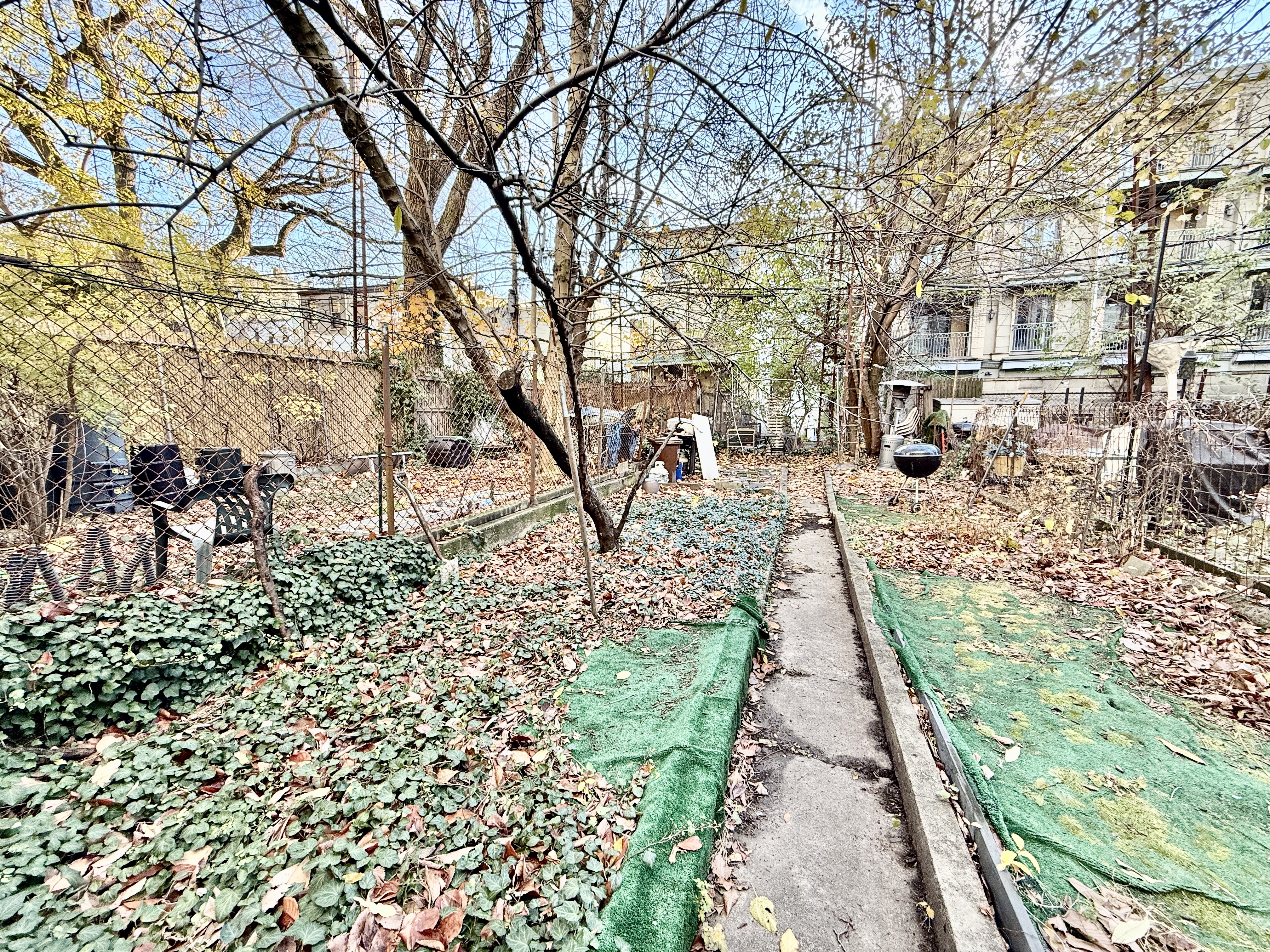 622 President Street, Unit 4 Brooklyn, NY 11215 - Photo 8 of 8 a pathway of a yard with plants and large trees