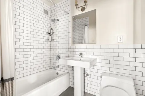 a bathroom with a bathtub and sink