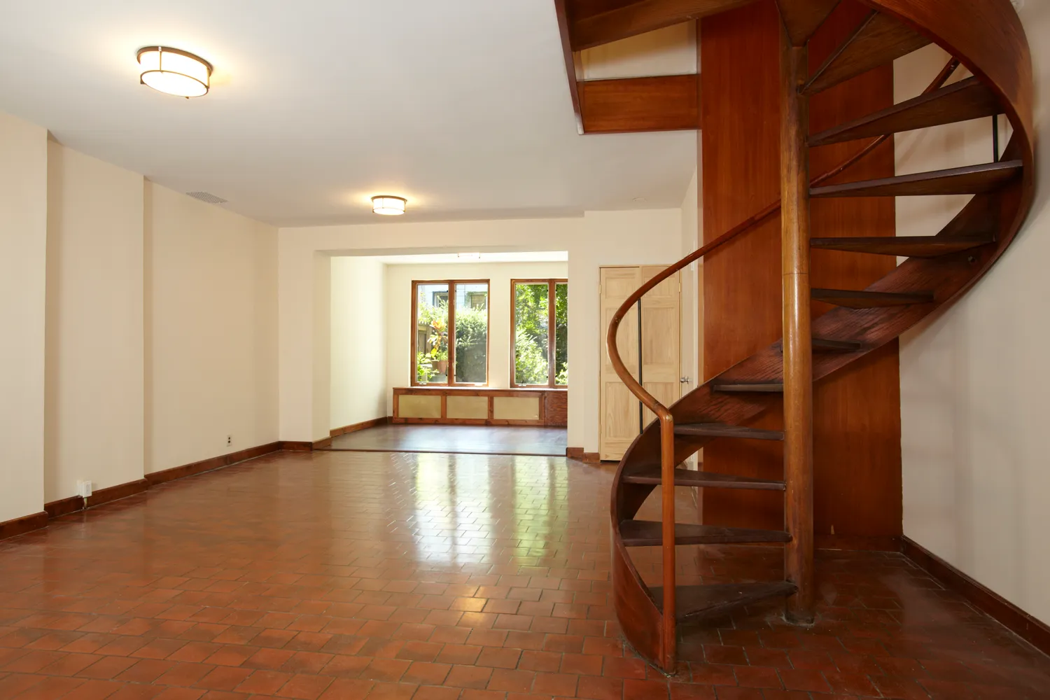 a view of an entryway with wooden floor