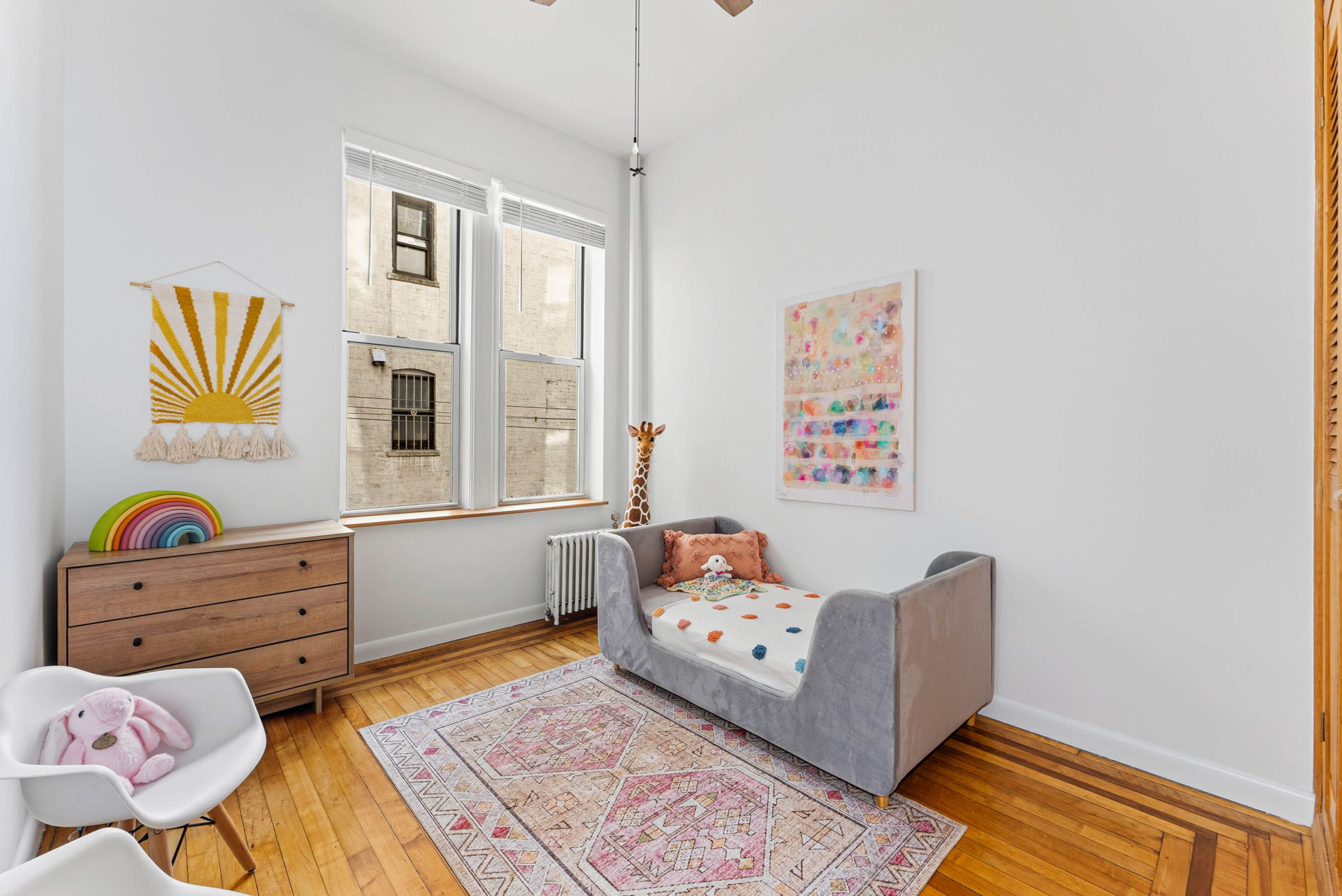 826 43rd Street, Unit 1 Brooklyn, NY 11232 - Photo 6 of 12 a living room with furniture and window