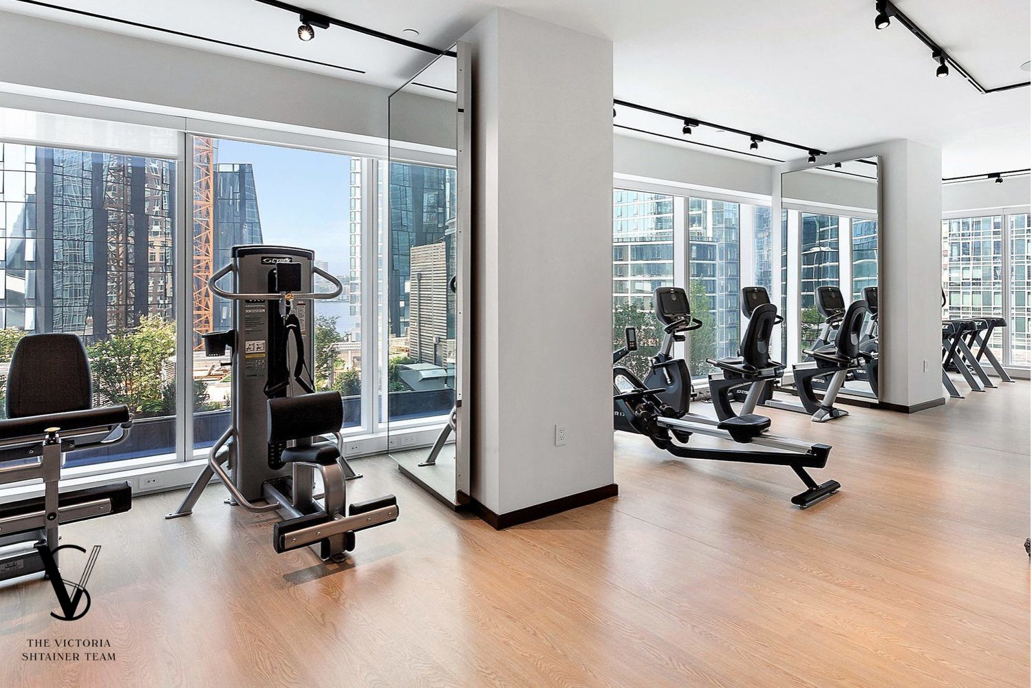 1 West End Avenue, Unit C28 Manhattan, NY 10069 - Photo 23 of 26 a view of a livingroom with gym equipment and floor to ceiling window