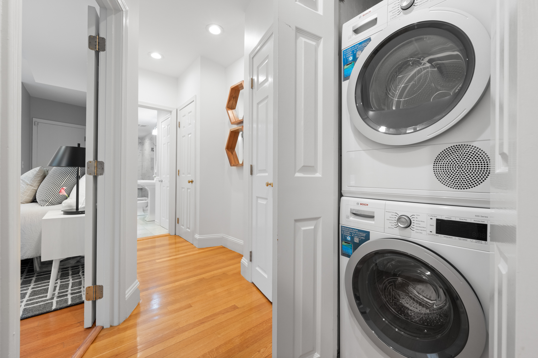 63 West Cedar Street, Unit 3 Boston, MA 02114 - Photo 13 of 17 a view of a hallway with washer and dryer