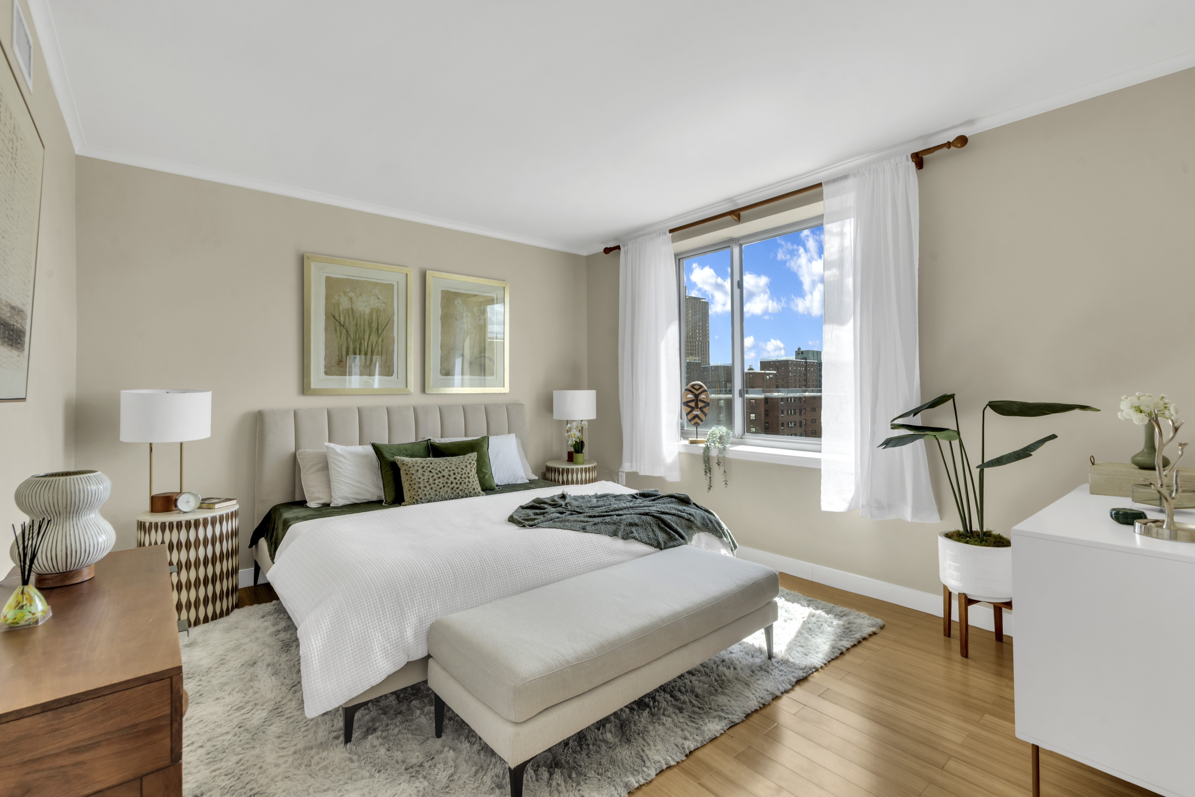 40 West 116th Street, Unit PHA1208 Manhattan, NY 10026 - Photo 7 of 28 a bedroom with a bed a table and windows