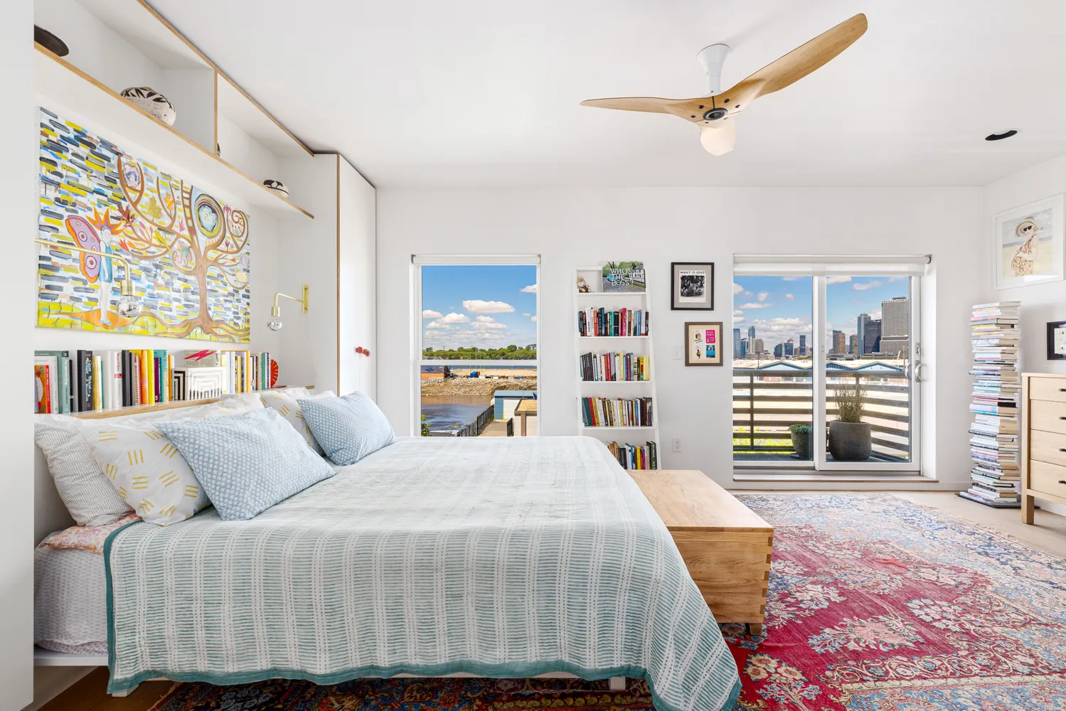 a bedroom with a large bed and a large window