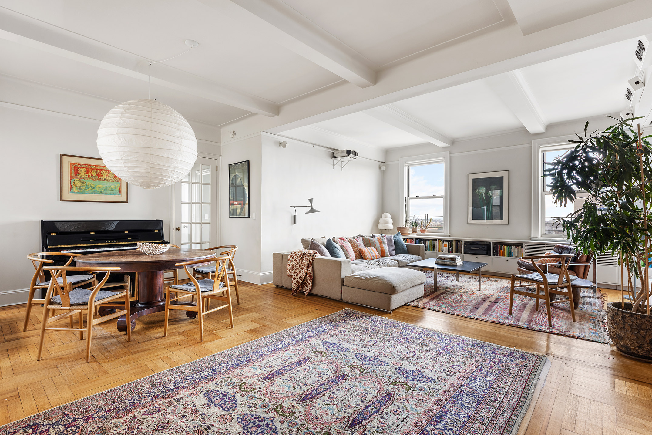 41 Eastern Parkway, Unit 11E Brooklyn, NY 11238 - Photo 2 of 14 a living room with furniture a rug and a window
