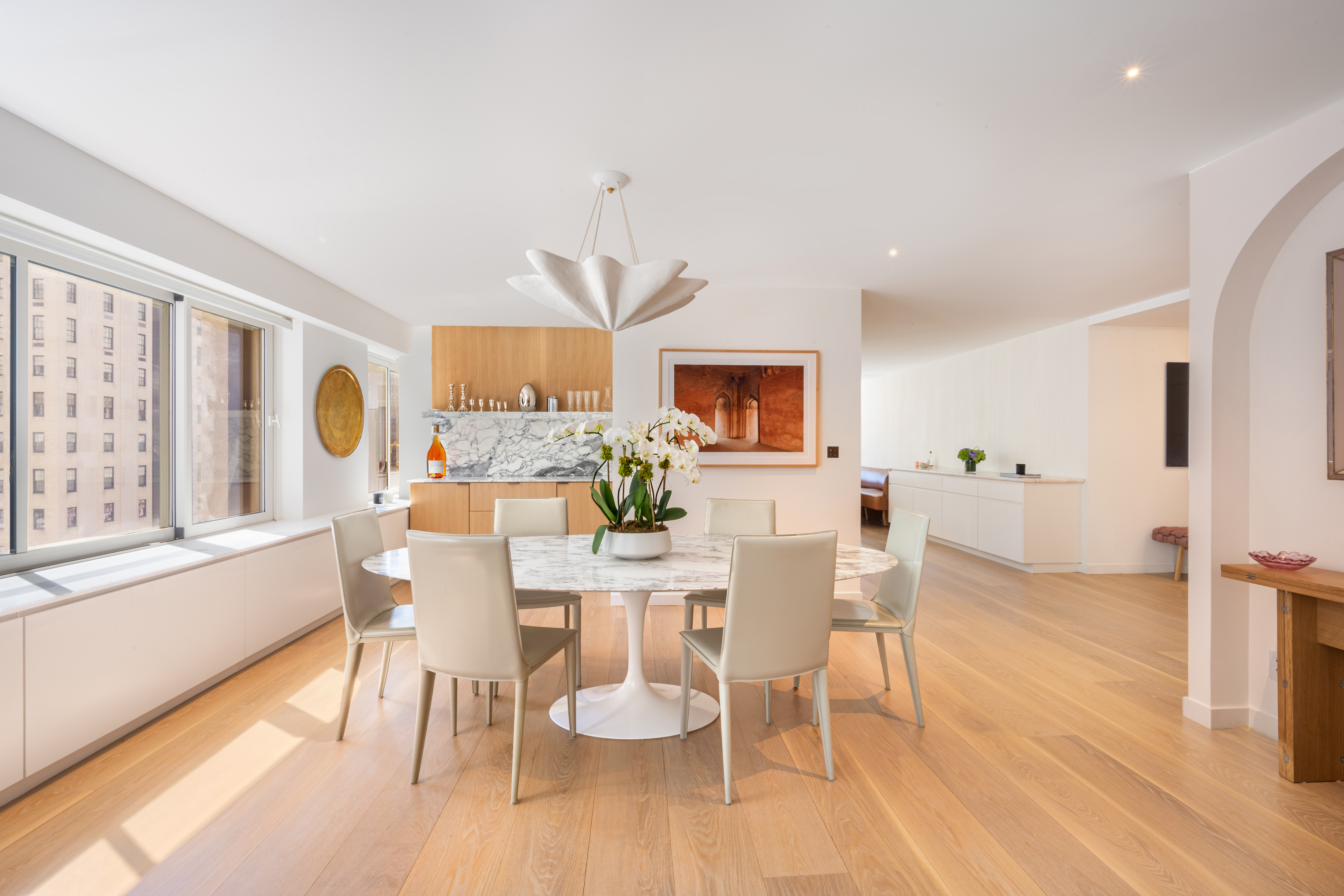 900 Park Avenue, Unit 7ABCE Manhattan, NY 10075 - Photo 5 of 18 a view of a dining room with furniture window and wooden floor