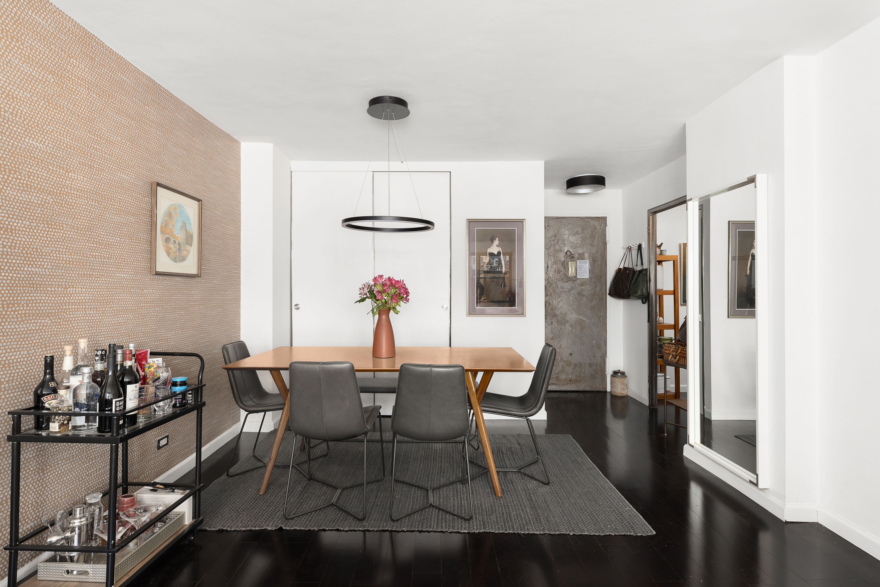 10 West 15th Street, Unit 1721 Manhattan, NY 10011 - Photo 3 of 10 a view of a dining room with furniture and a window