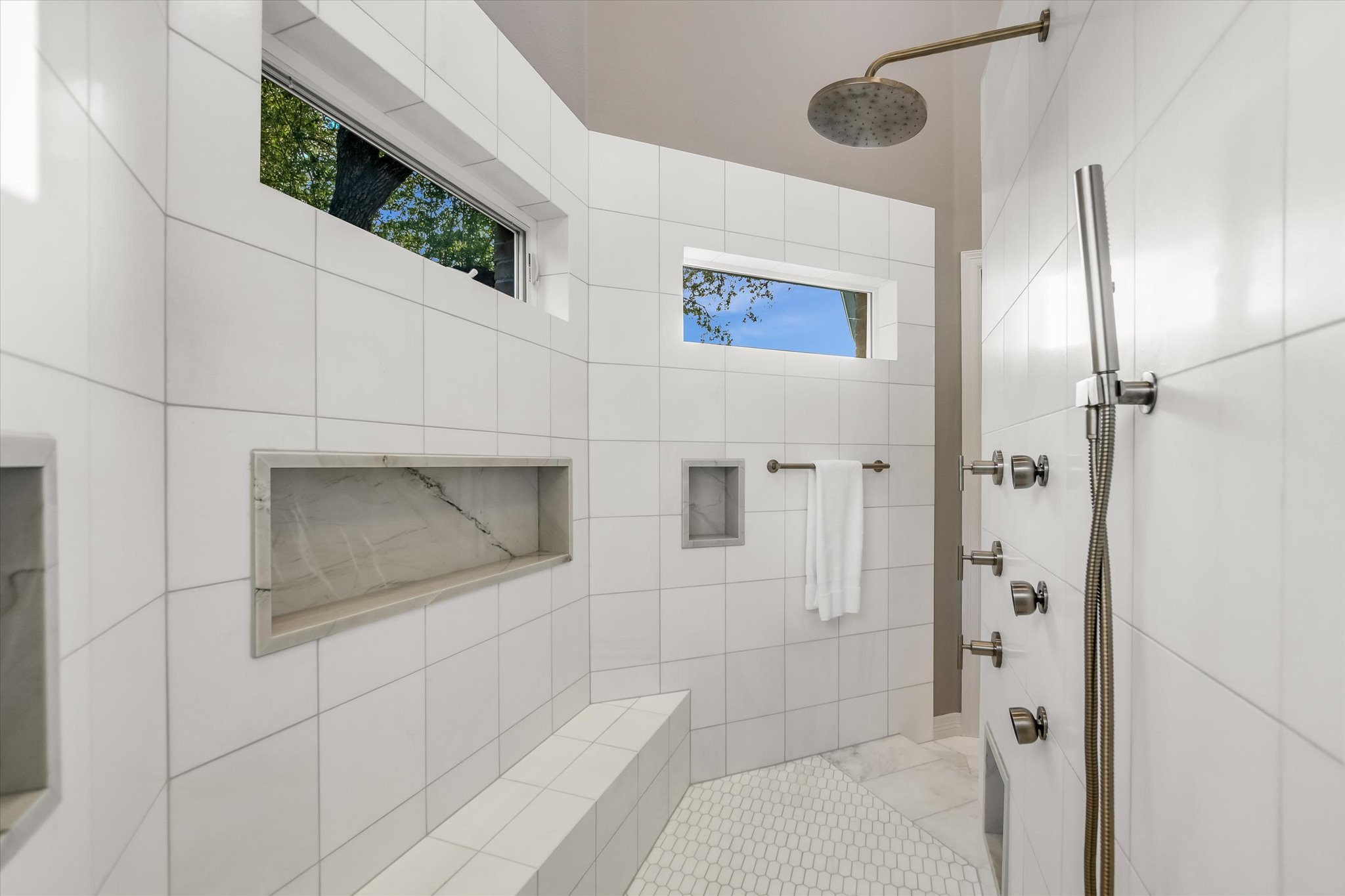 1422 Palomino Ridge Drive Austin, TX 78733 - Photo 29 of 60 a bathroom with a shower and a mirror