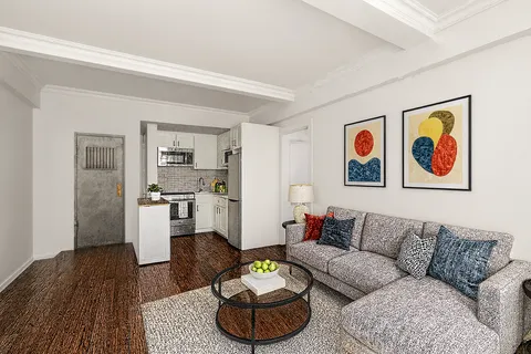 a living room with furniture and a rug