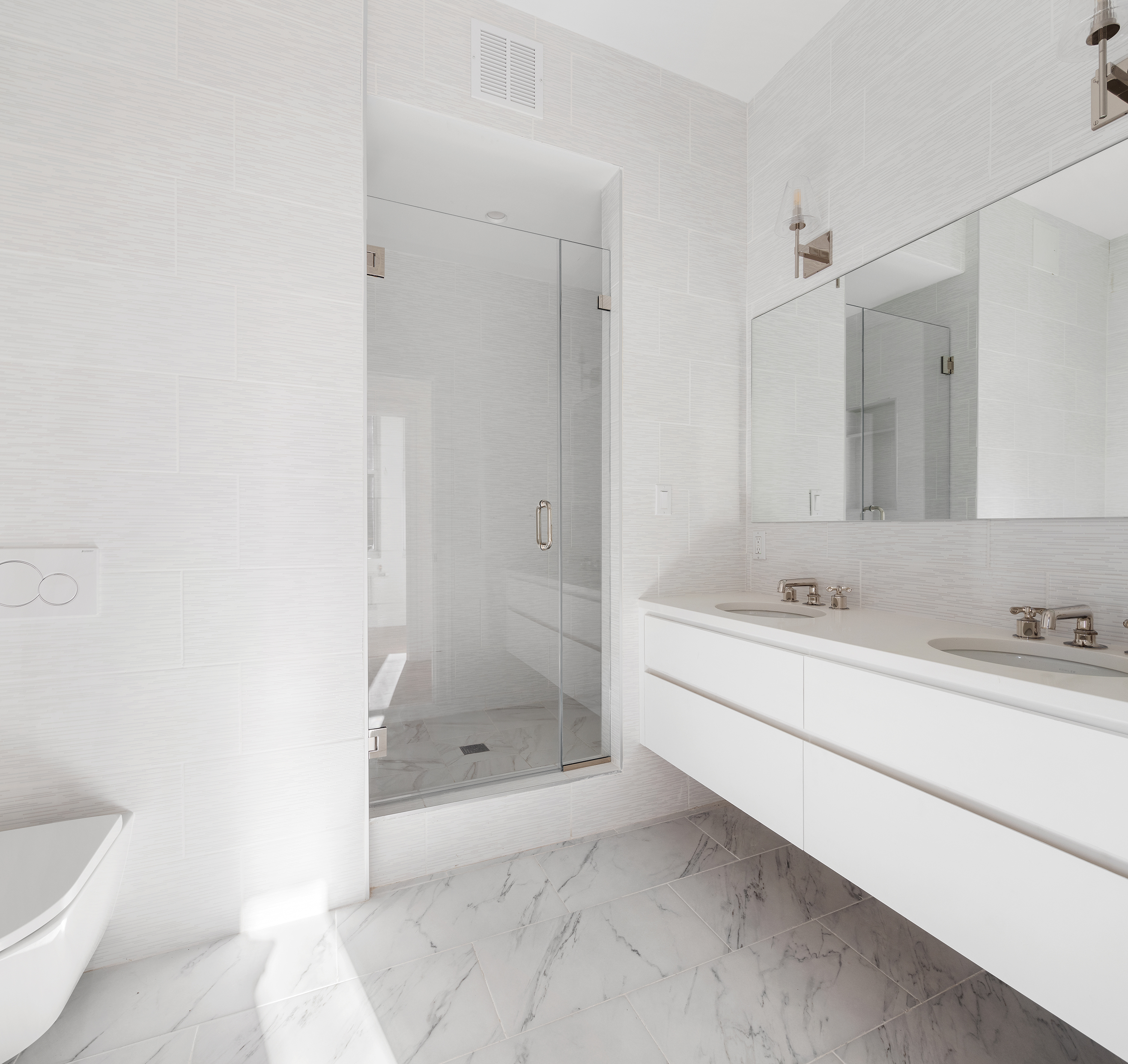 55 Liberty Street, Unit 13C Manhattan, NY 10005 - Photo 7 of 9 a bathroom with a bathtub sink and toilet