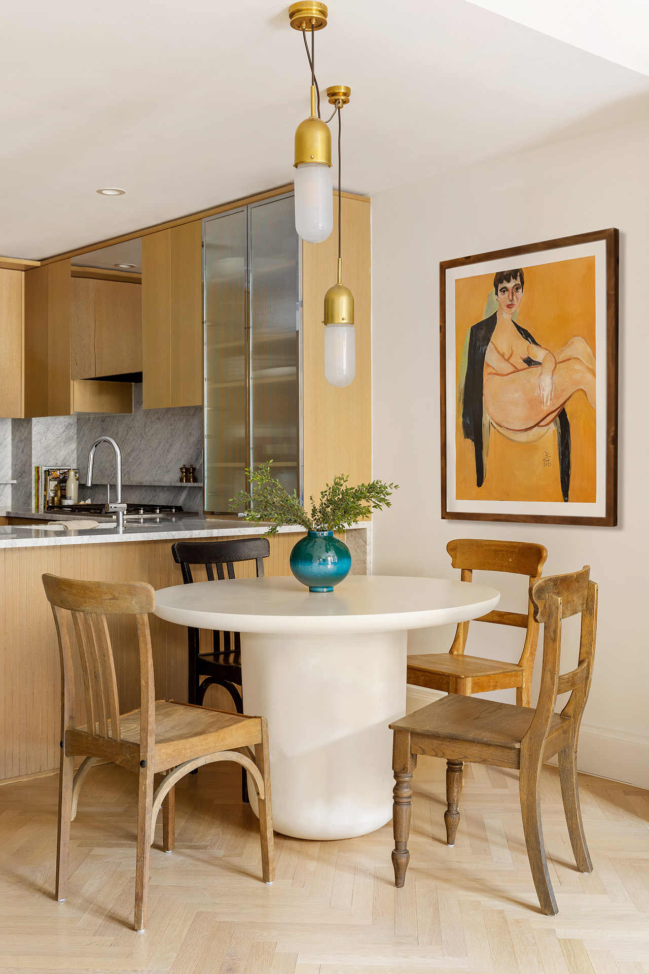 300 West 122nd Street, Unit 5N Manhattan, NY 10027 - Photo 3 of 28 a living room with a dining table and paintings on the wall