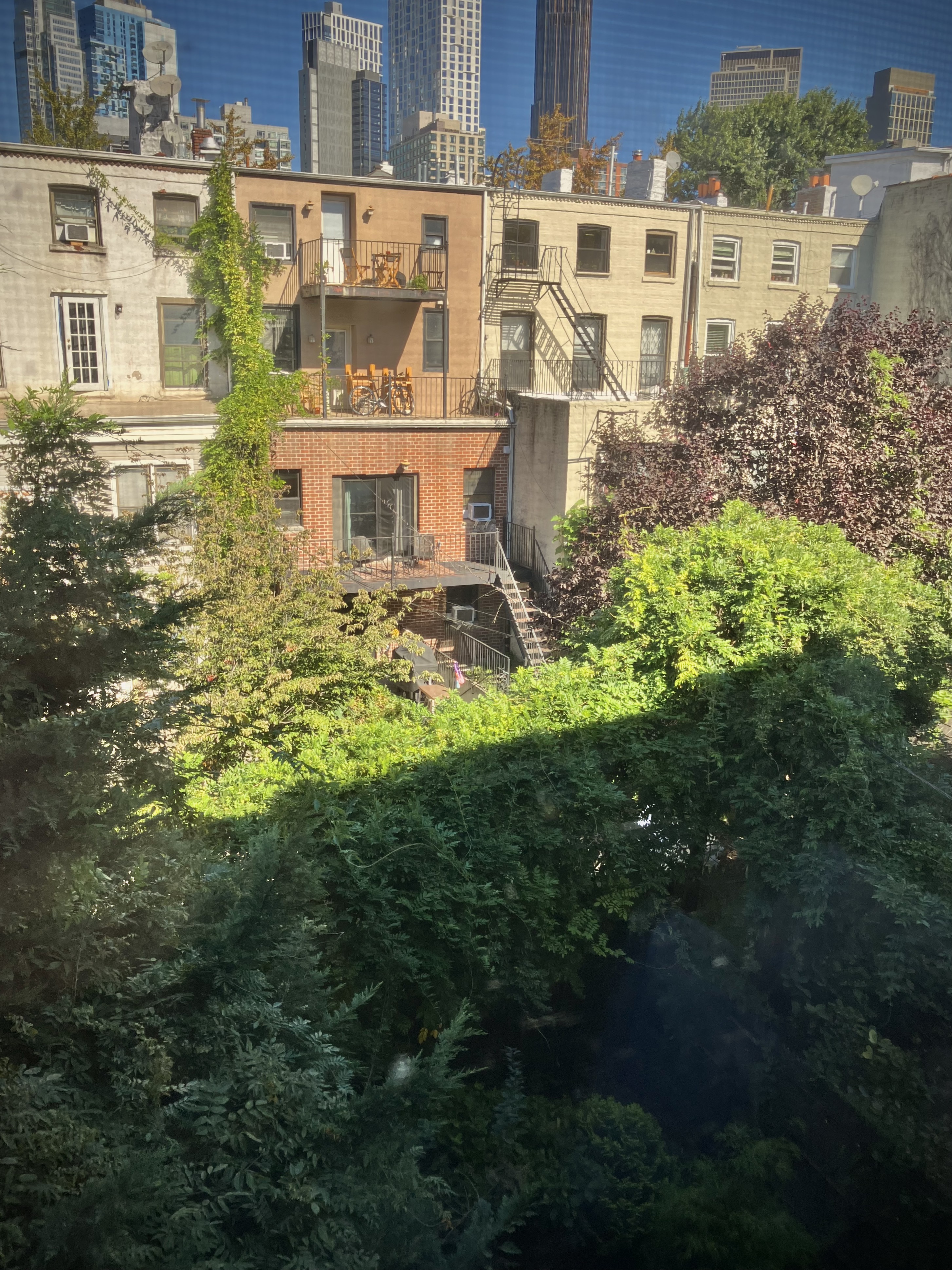 97 Bergen Street, Unit 6 Brooklyn, NY 11201 - Photo 7 of 7 a view of a residential apartment building with a yard