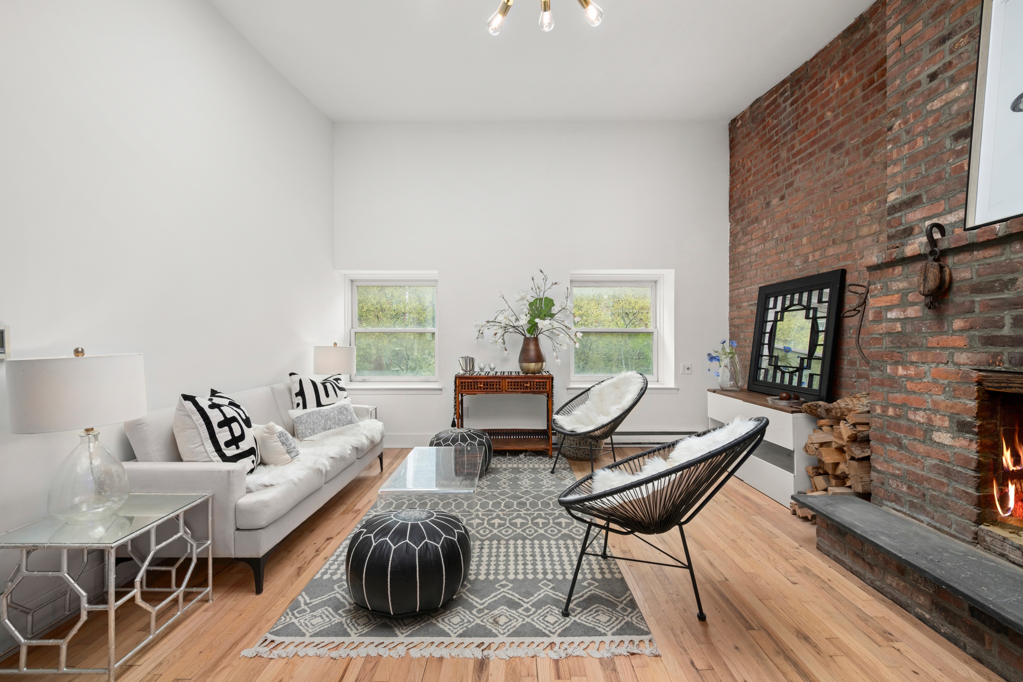 354 West 23rd Street, Unit 4A Manhattan, NY 10011 - Photo 2 of 7 a living room with furniture and a fireplace
