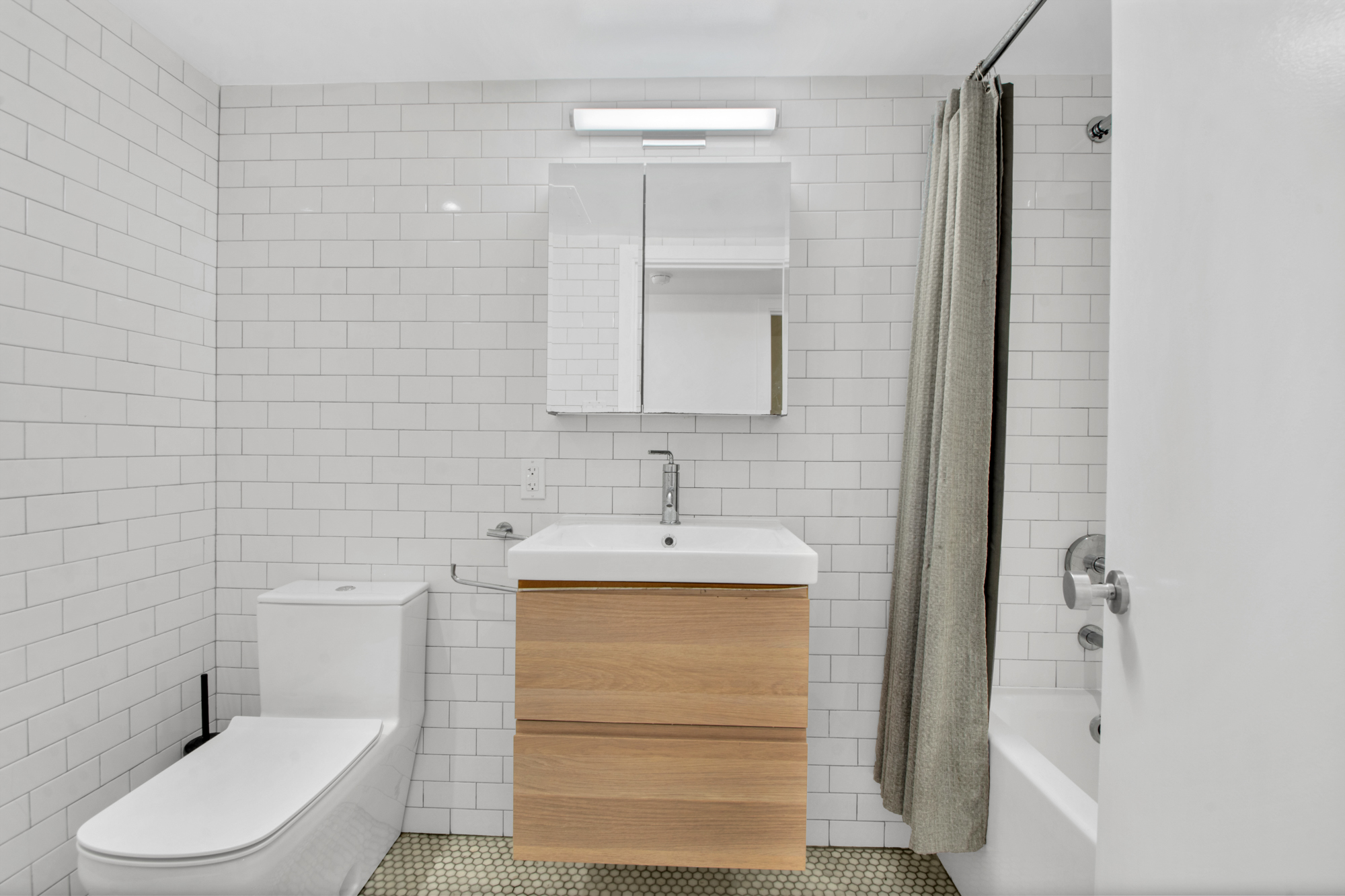 435 Putnam Avenue, Unit GARDEN Brooklyn, NY 11221 - Photo 5 of 11 a bathroom with a toilet sink and shower