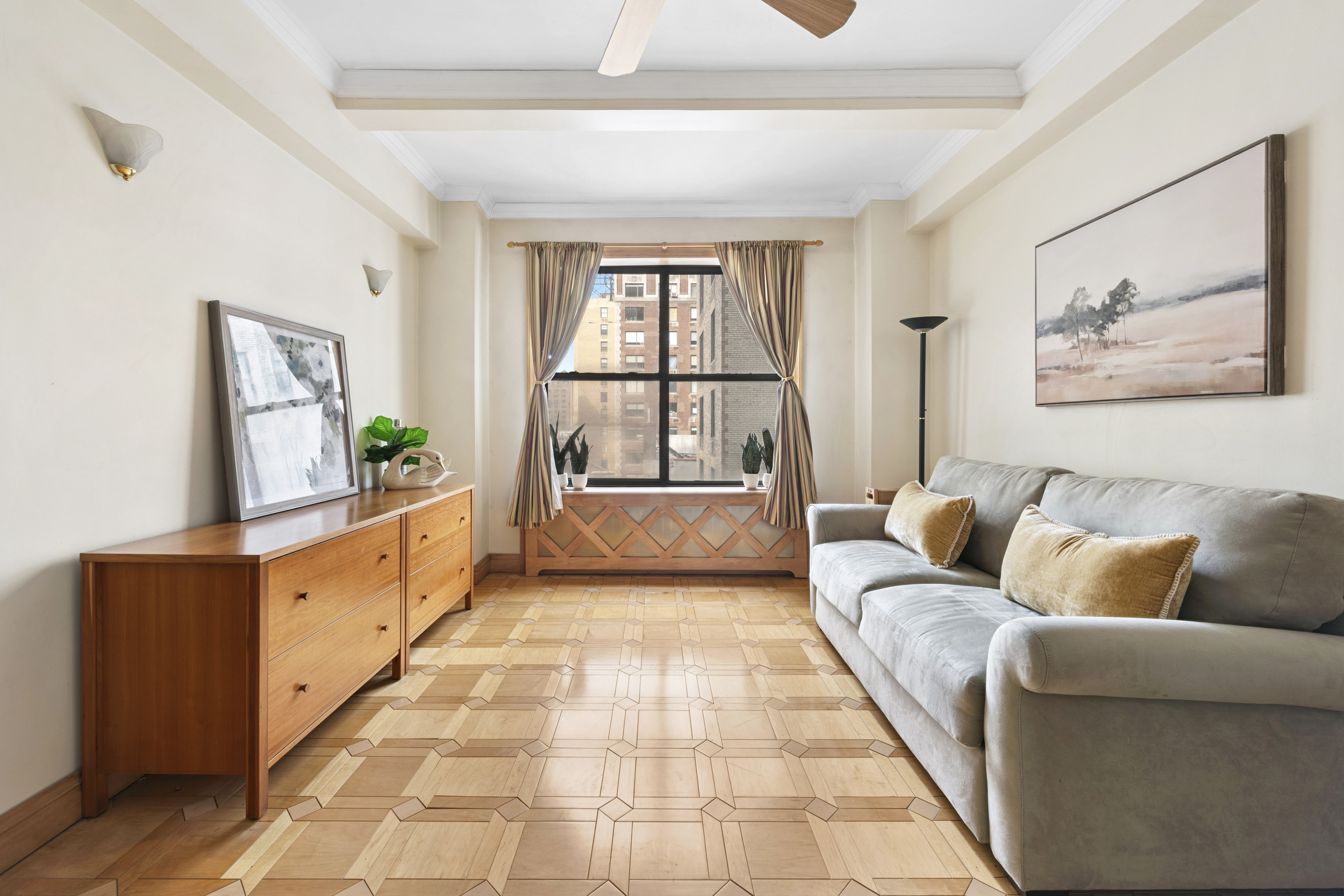 225 Central Park West, Unit 916 Manhattan, NY 10024 - Photo 2 of 13 a living room with furniture and a rug