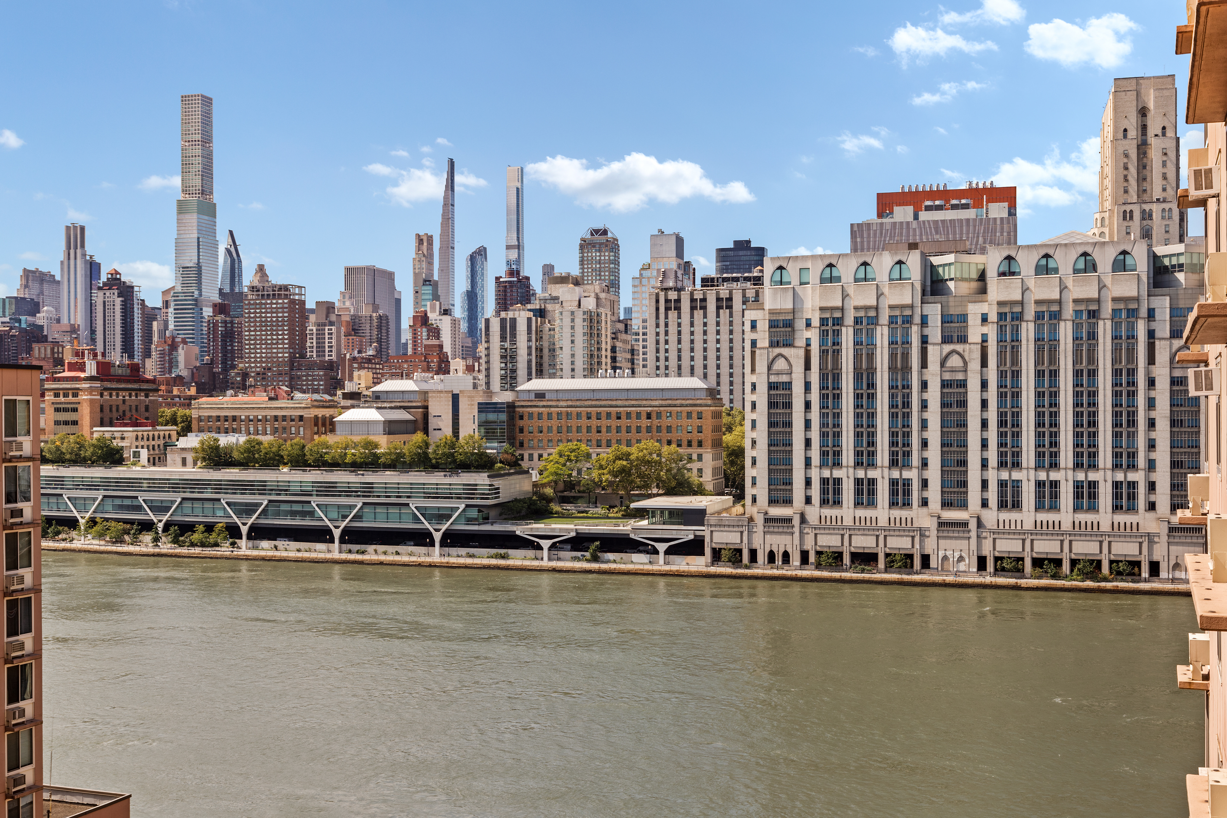 575 Main Street, Unit 1312 Manhattan, NY 10044 - Photo 12 of 25 a view of a city with tall buildings