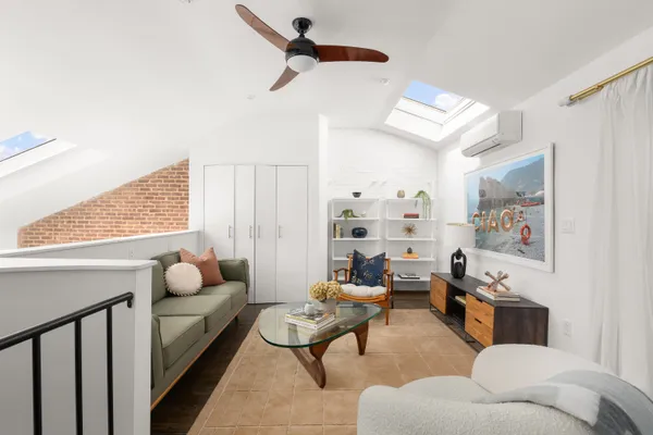 a living room with furniture and a window