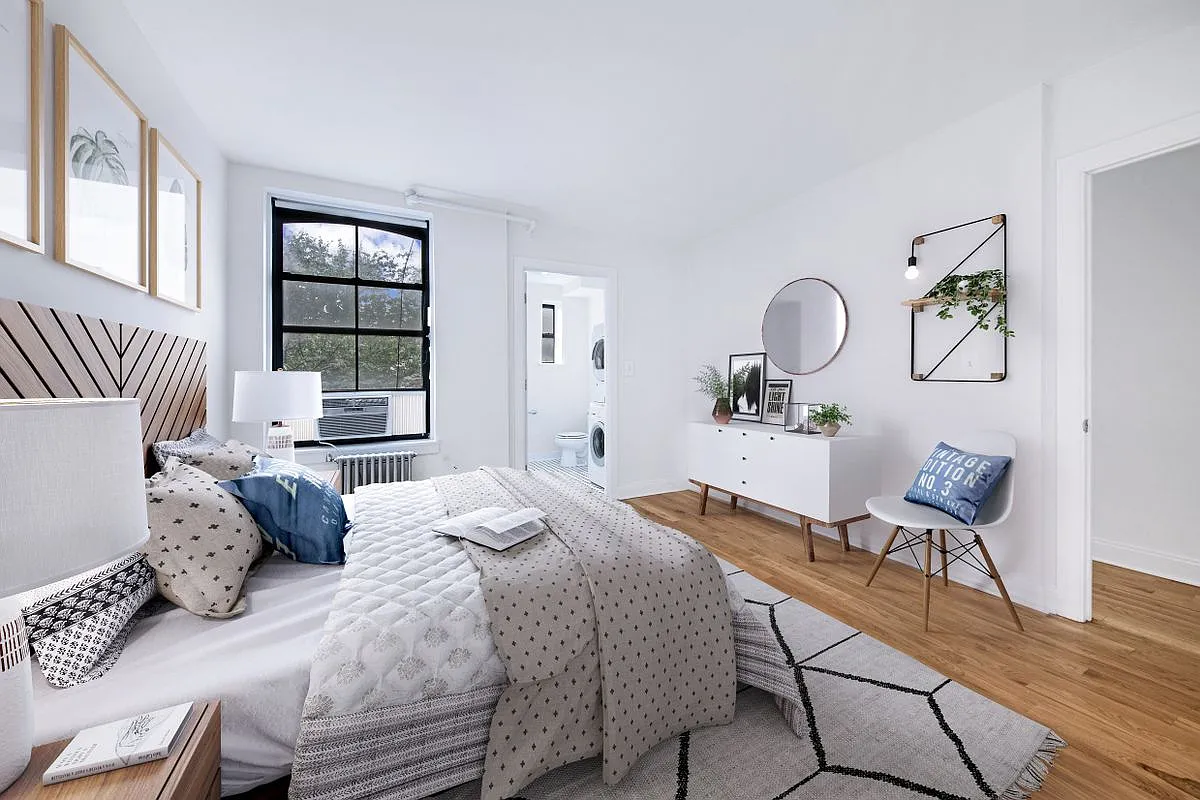 138 Baltic Street, Unit 3C Brooklyn, NY 11201 - Photo 4 of 10 a bedroom with a bed and wooden floor