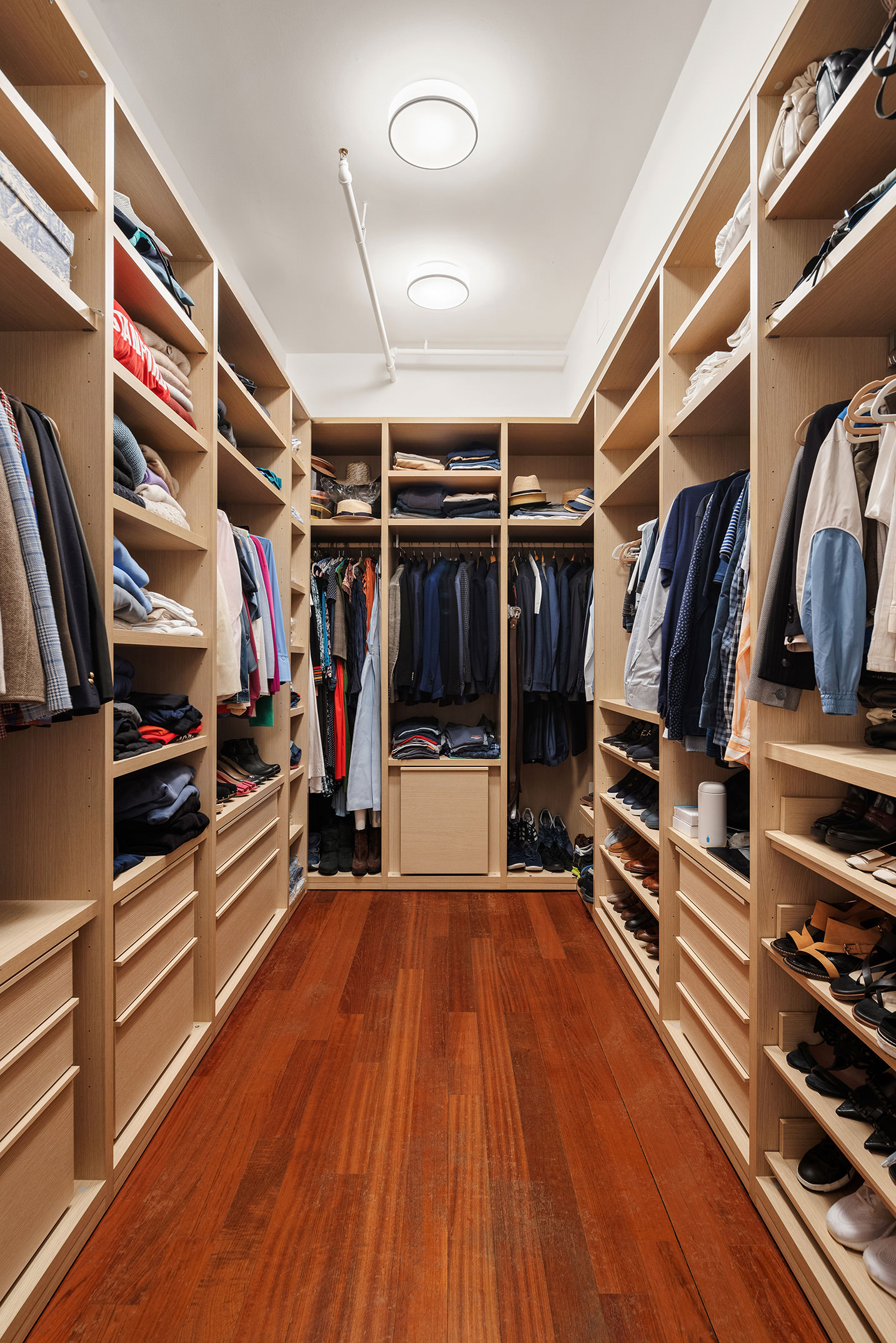 44 Laight Street, Unit 2A Manhattan, NY 10013 - Photo 15 of 28 a view of walk in closet with clothes and shoes