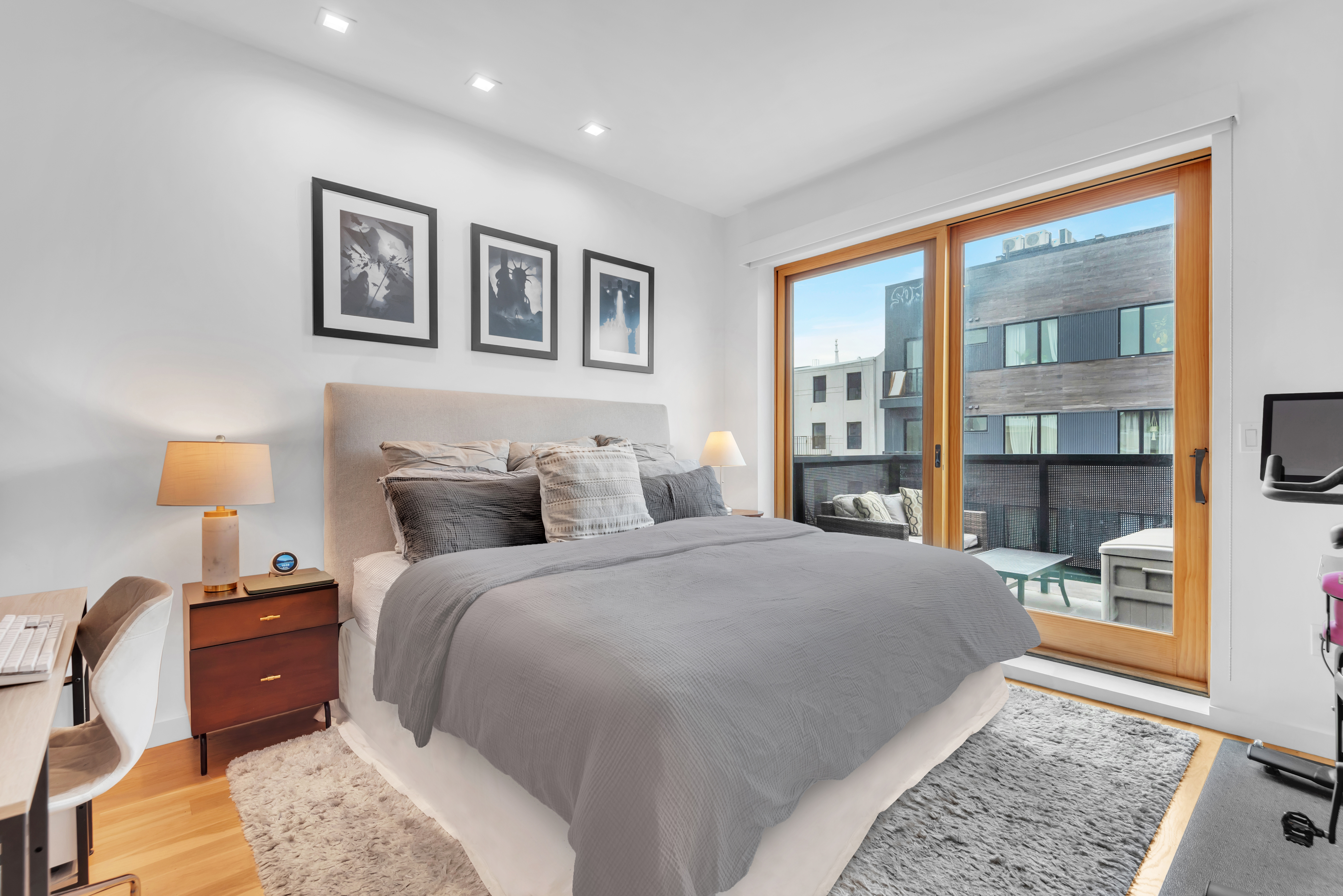 267 Evergreen Avenue, Unit 3A Brooklyn, NY 11221 - Photo 4 of 16 a bed room with a bed and a night stand