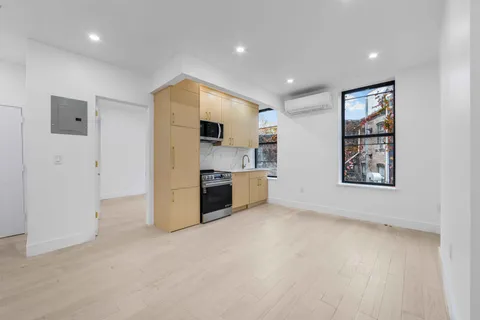a view of a kitchen with a sink dishwasher and a refrigerator