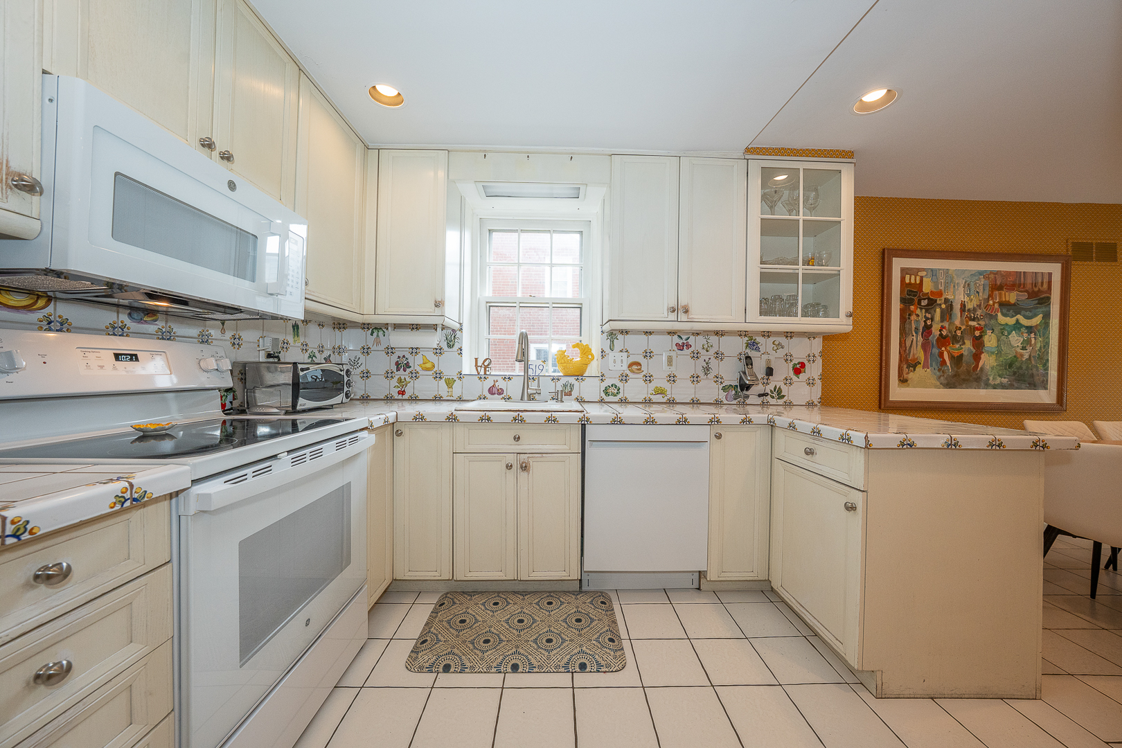519 Mercer Road Merion Station, PA 19066 - Photo 14 of 58 a kitchen with a sink stove and cabinets
