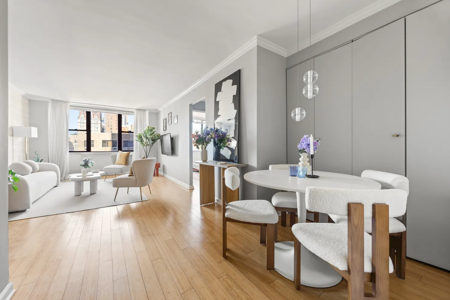 a view of a dining room with furniture and wooden floor