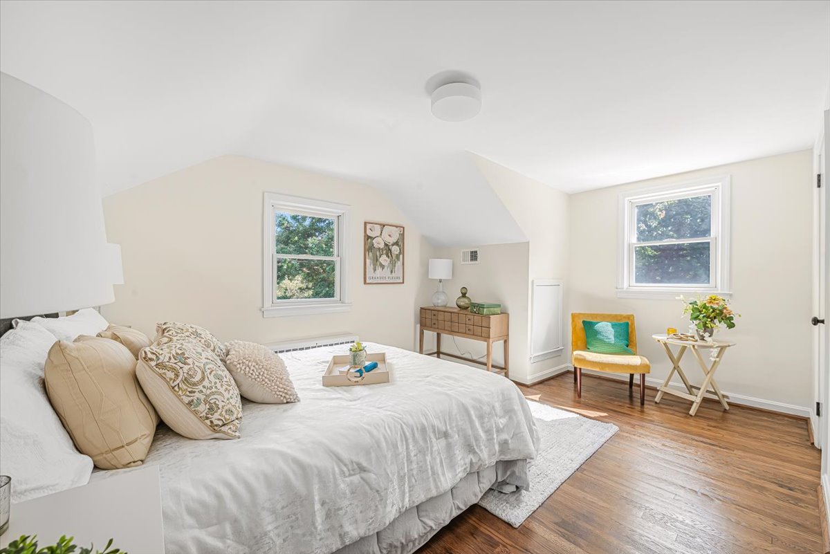 1902 Rookwood Road Silver Spring, MD 20910 - Photo 26 of 36 a bedroom with a bed and wooden floor