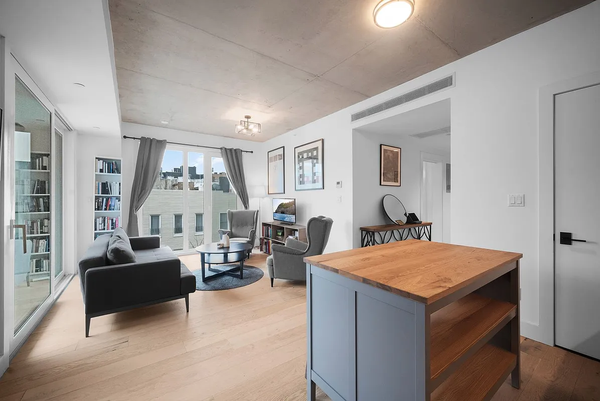 169 Huron Street, Unit 4A Brooklyn, NY 11222 - Photo 4 of 15 a living room with furniture and a table