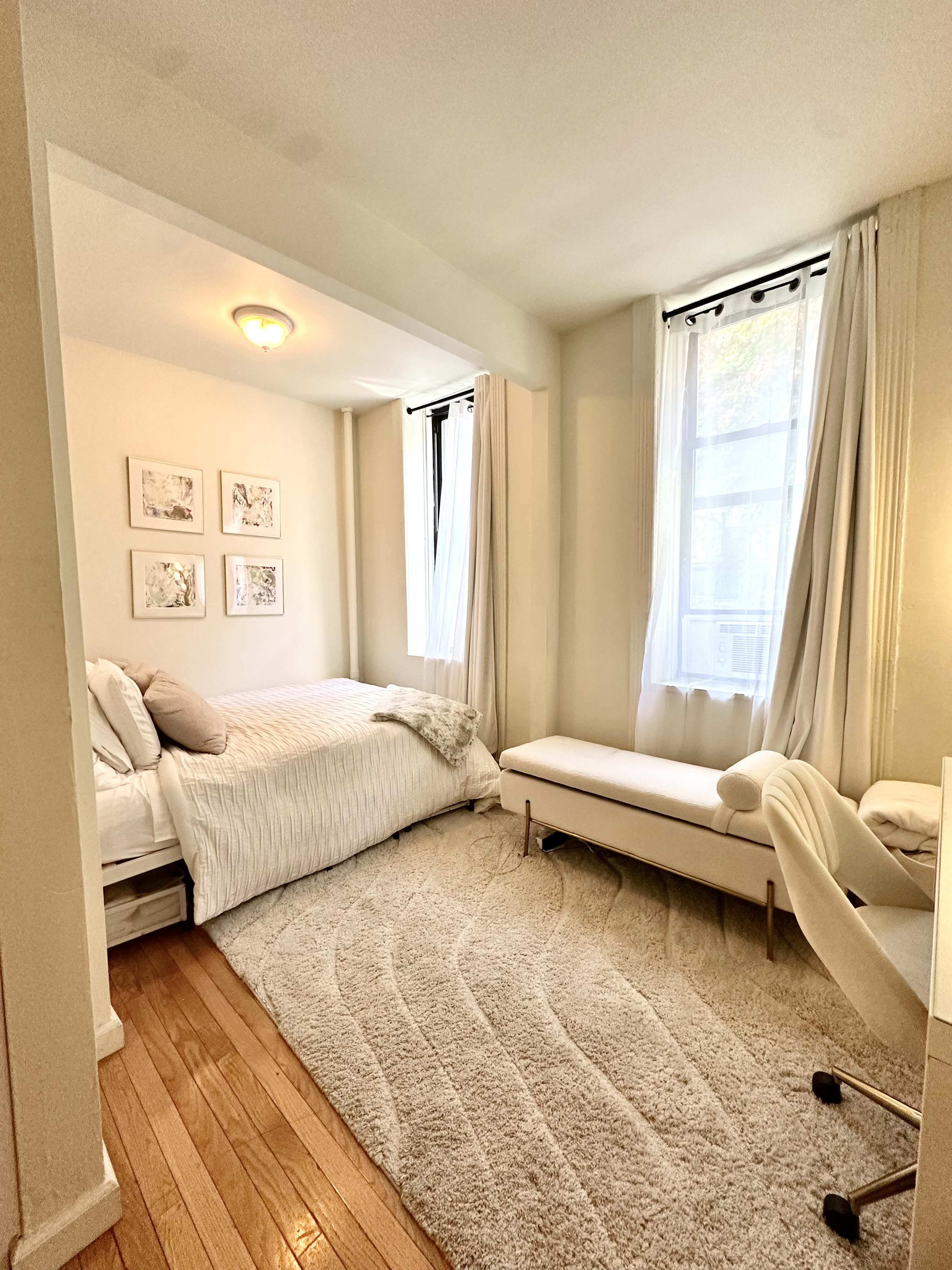 a bedroom with a bed and a couch