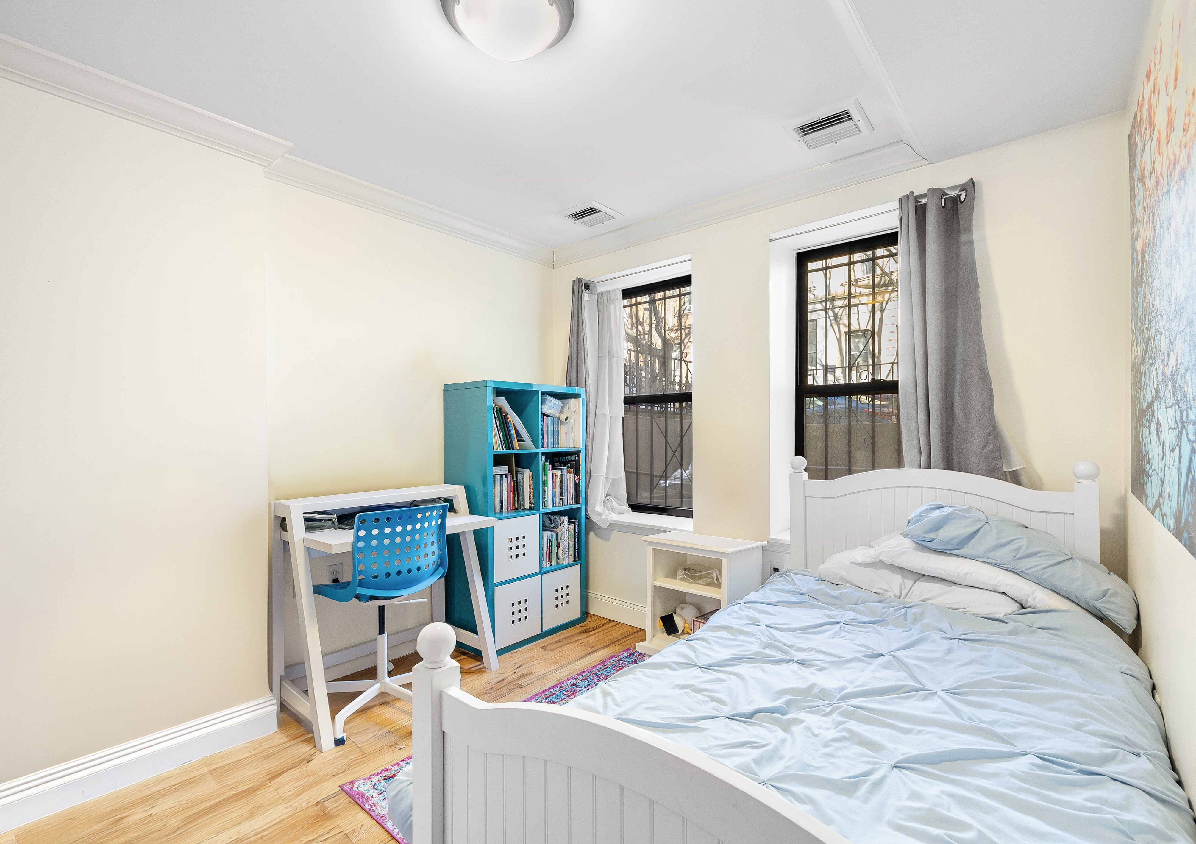 518 West 149th Street Manhattan, NY 10031 - Photo 7 of 23 a bedroom with furniture and a window