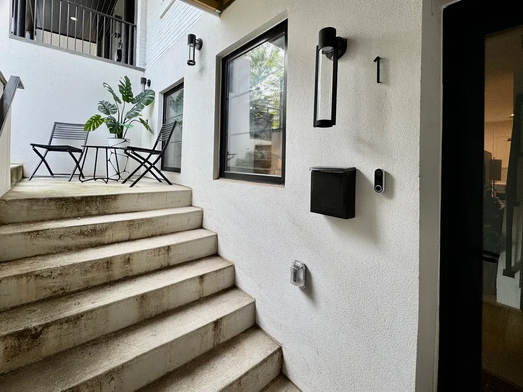 a view of entryway and hall with wooden floor