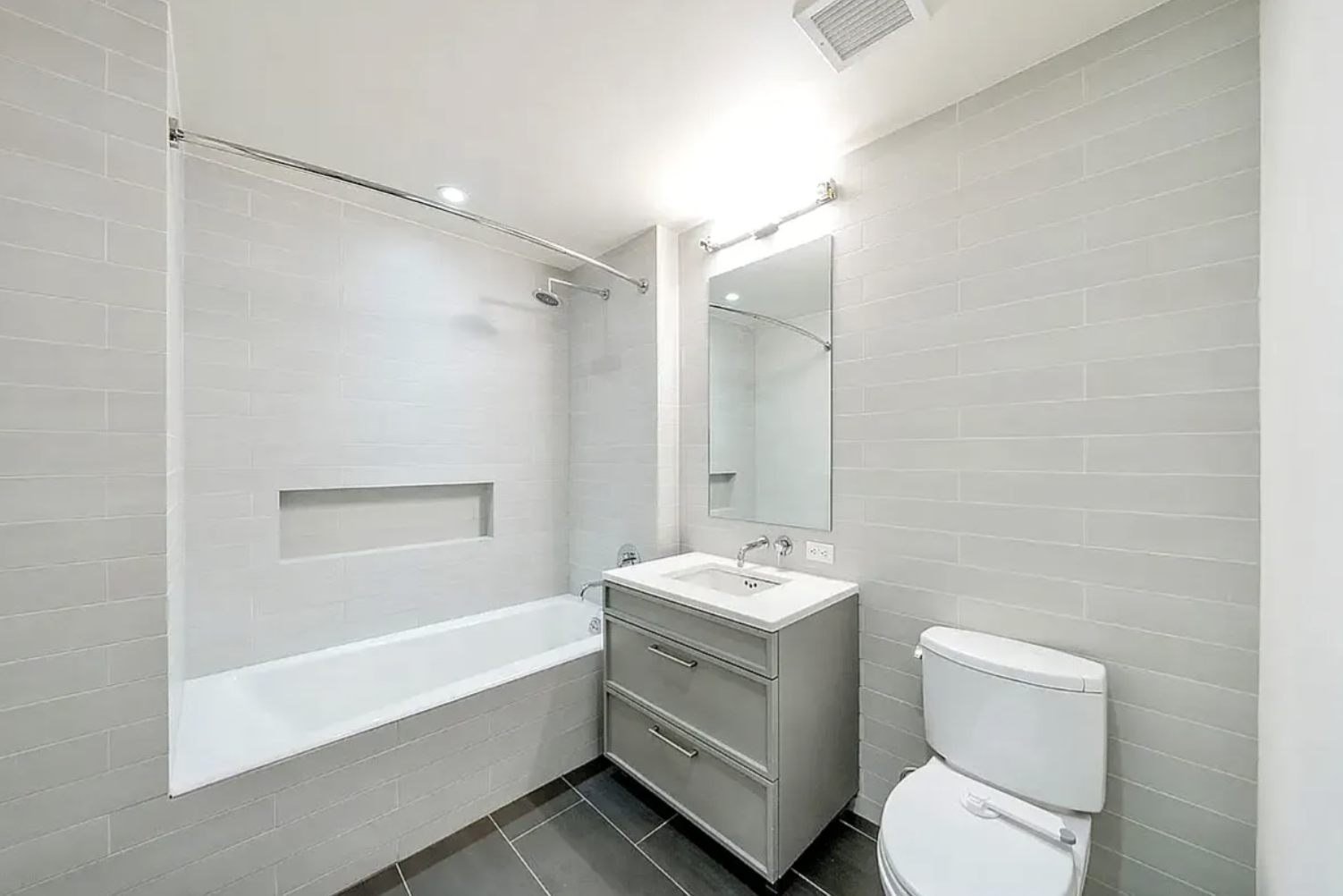 160 East 22nd Street, Unit 9E Manhattan, NY 10010 - Photo 11 of 17 a bathroom with a toilet a sink and a bathtub