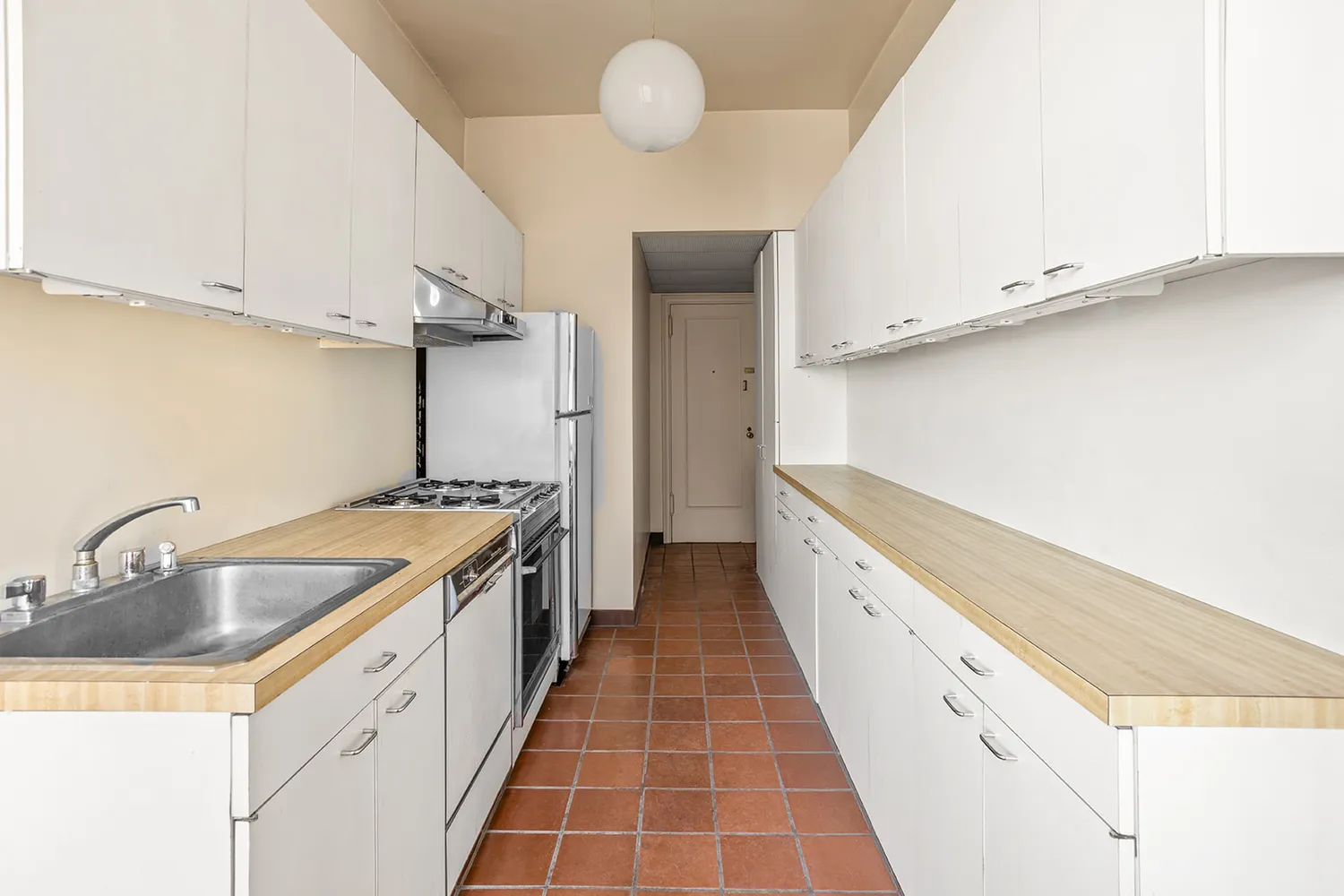 a kitchen with granite countertop a sink and cabinets