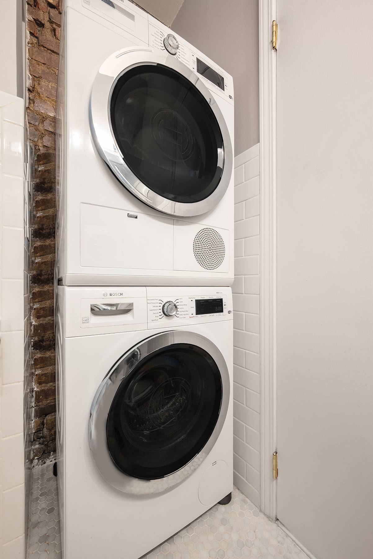 5 Charles Street, Unit 3R Manhattan, NY 10014 - Photo 11 of 14 a close up view of a washer and dryer