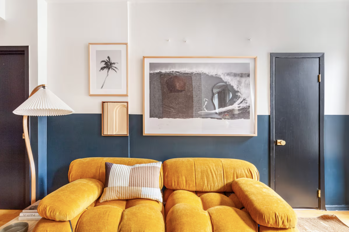 240 Mulberry Street, Unit 2 Manhattan, NY 10012 - Photo 7 of 19 a blue bed with a painting on the wall and a lamp