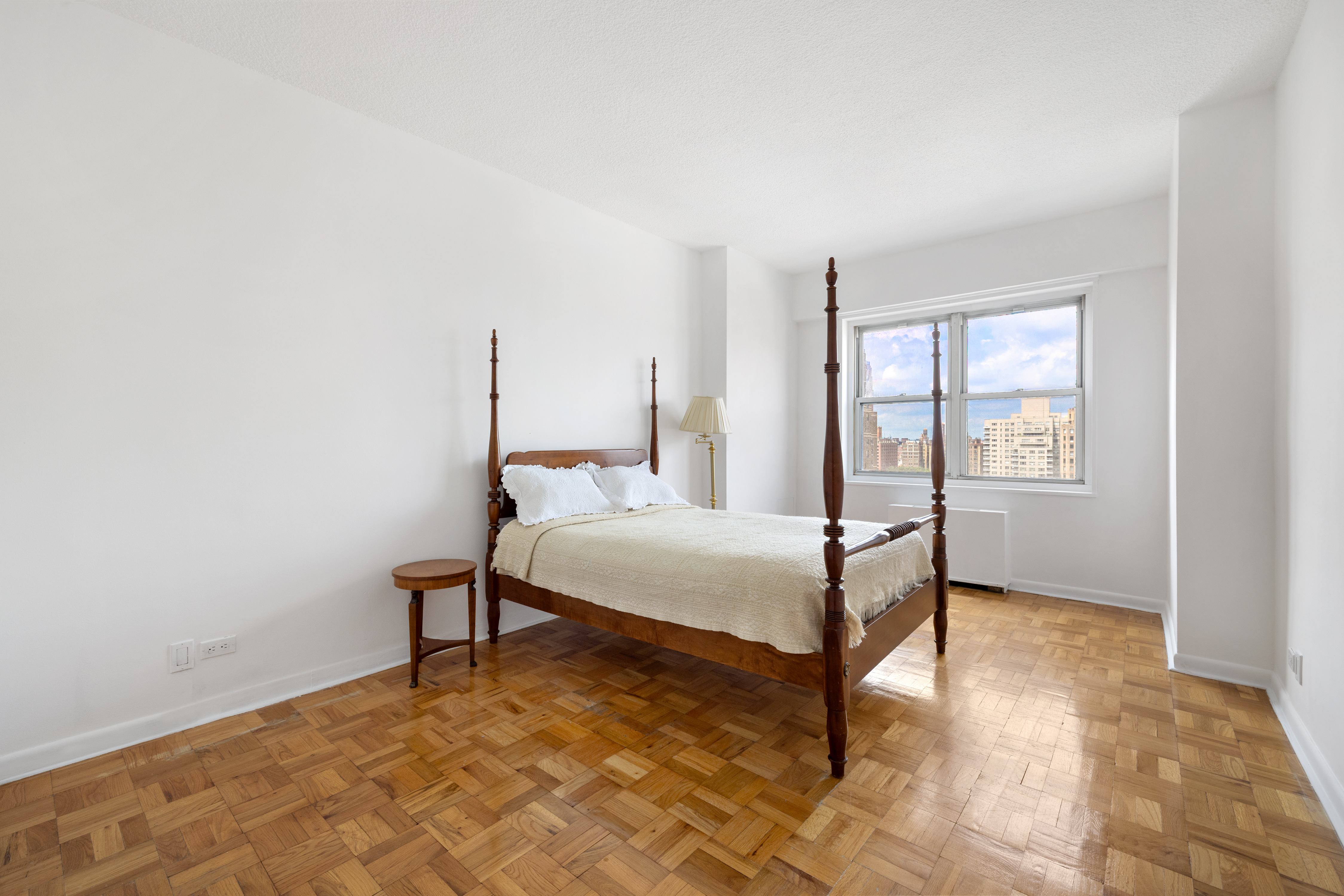 60 East 8th Street, Unit 15D Manhattan, NY 10003 - Photo 6 of 14 a bedroom with a bed and a window