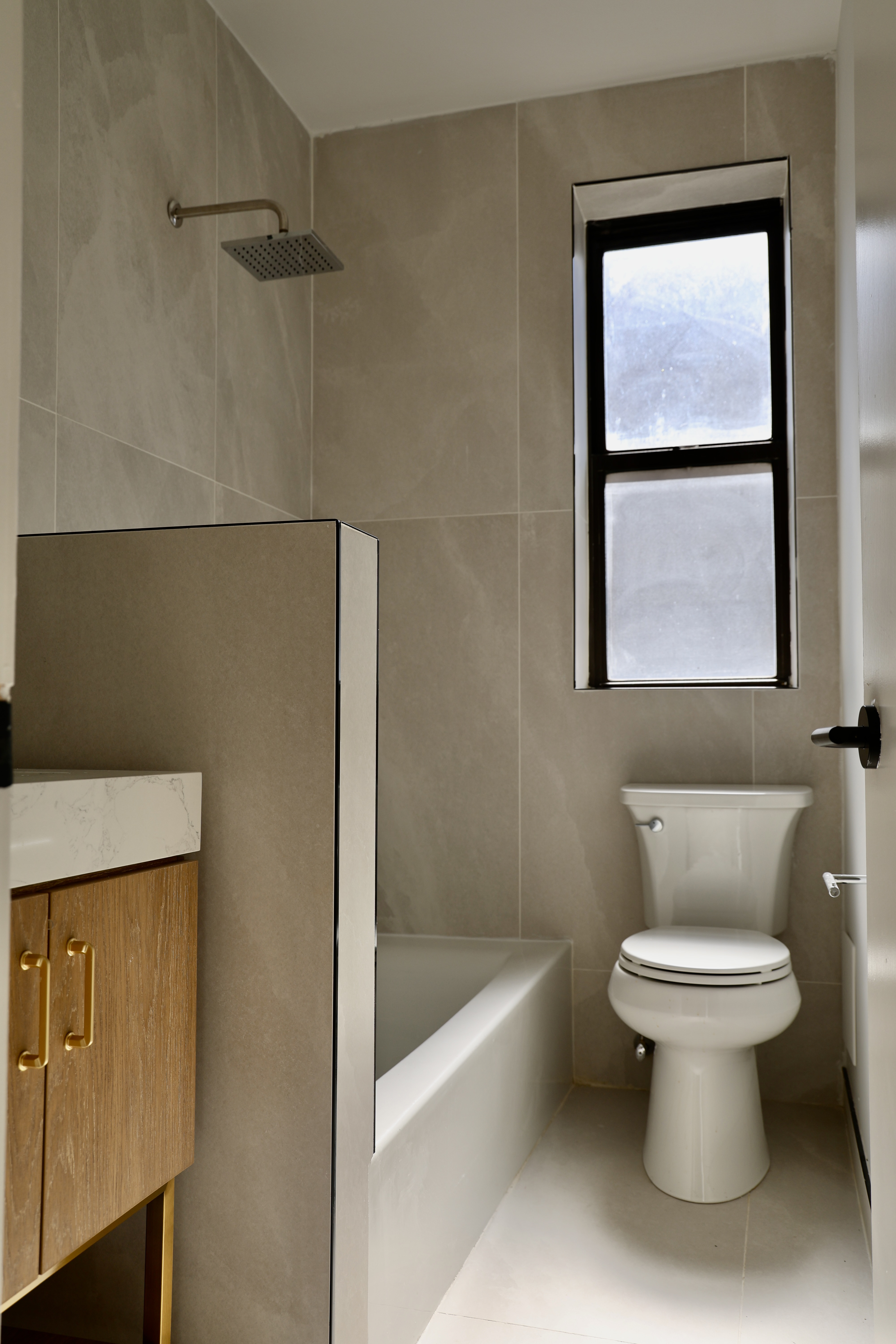 807 Riverside Drive, Unit 6E Manhattan, NY 10032 - Photo 7 of 7 a bathroom with a toilet and a bathtub